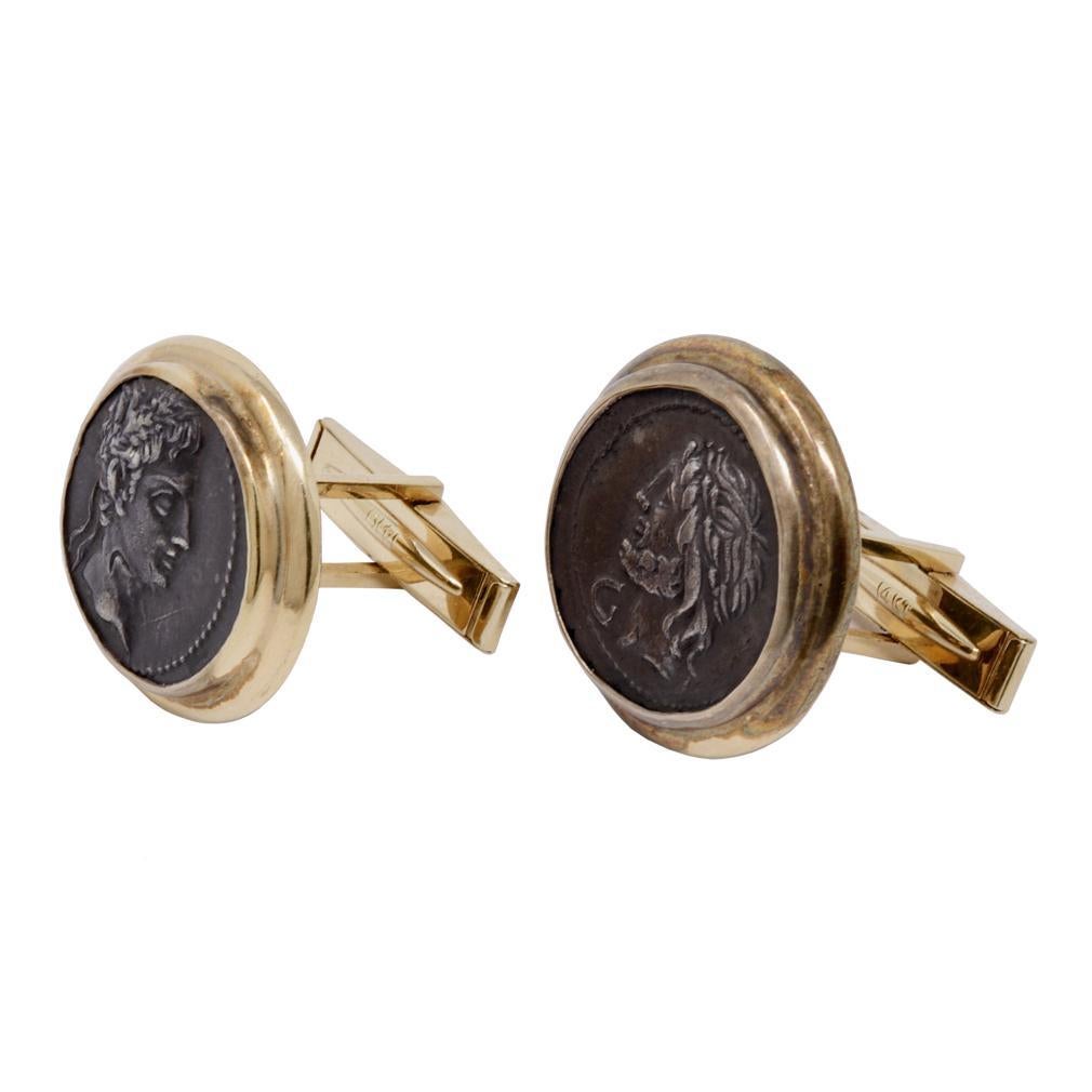 Authentic Roman Coin Cufflinks. Each silver coin set in 14K yellow gold frame, open at the back with a post and spring flipped whale-back. Each frame is stamped 14K FOXS (A Seattle Jeweler). One coin with the frame inscription “MARCH 1987” and the