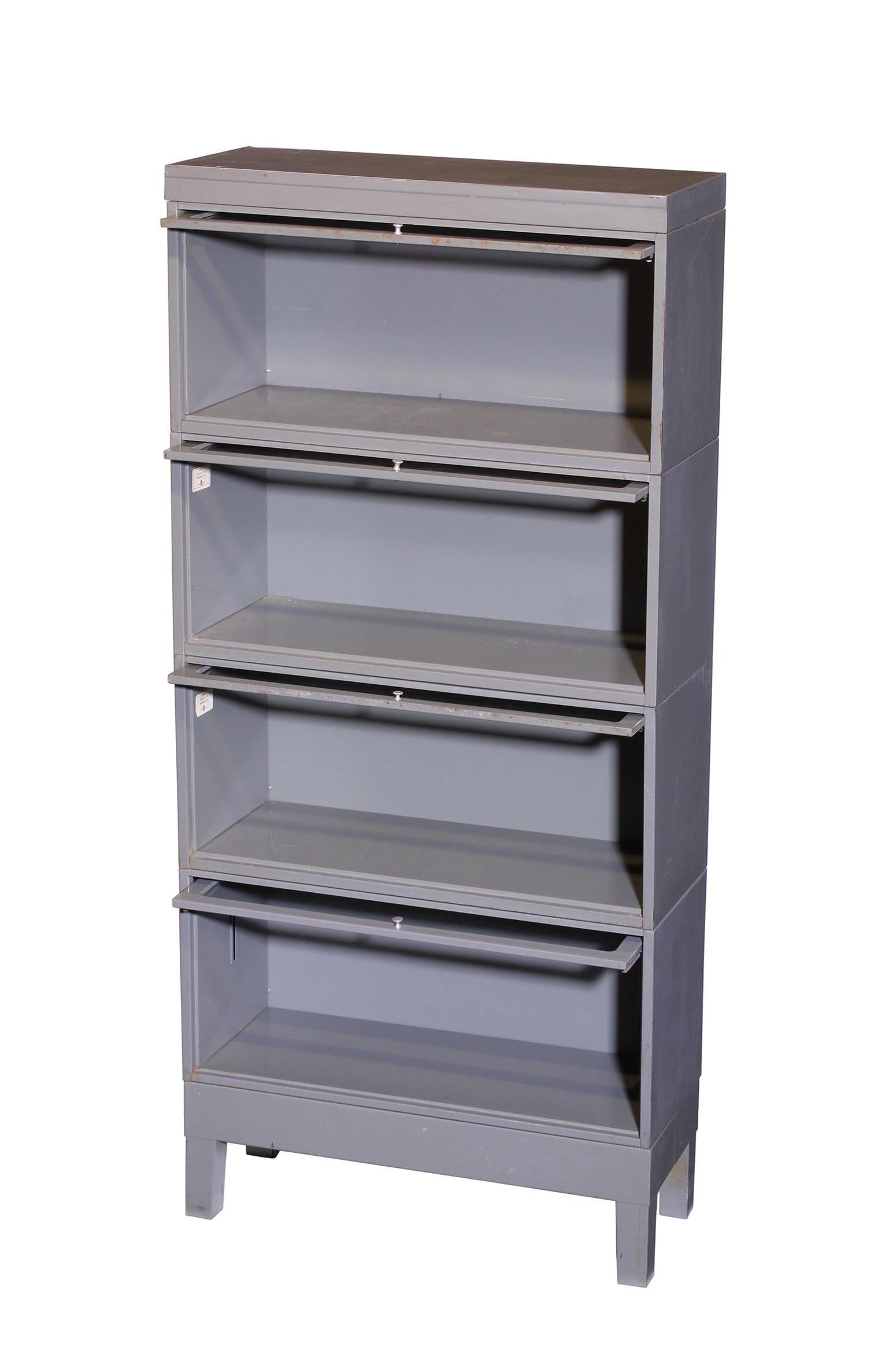 4-section, Globe Wernicke Barrister lawyers bookcase. In original gray paint with original glass. Very good condition with slight wear. Dimensions: Overall width 33.125