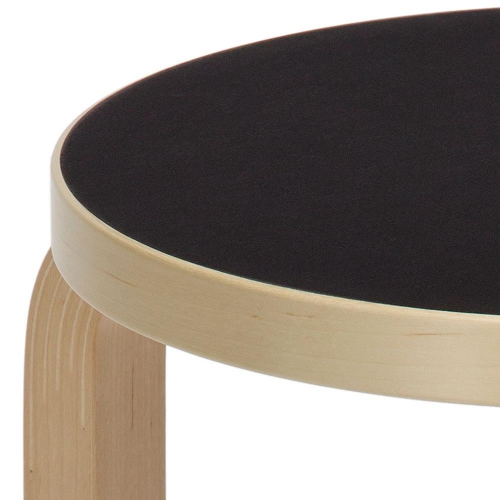 Authentic stool E60 in lacquered birch with linoleum seat by Alvar Aalto & Artek. Projecting a sense of relaxed familiarity, stool E60 is equally suited to the home, public buildings, and educational facilities. The legs are mounted directly to the