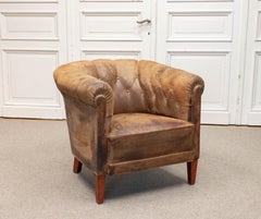 Authentic Swedish Chesterfield Club Chair with Patinated And Worn Leather. 1920s