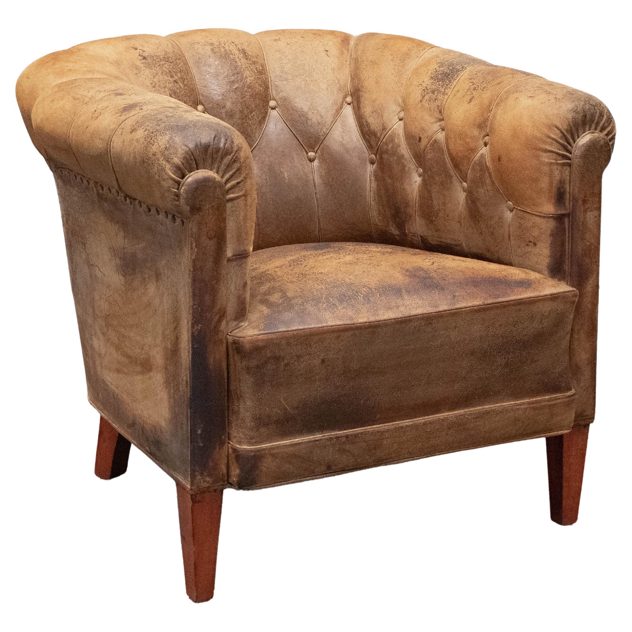 Authentic Swedish Chesterfield Club Chair with Patinated And Worn Leather. 1920s