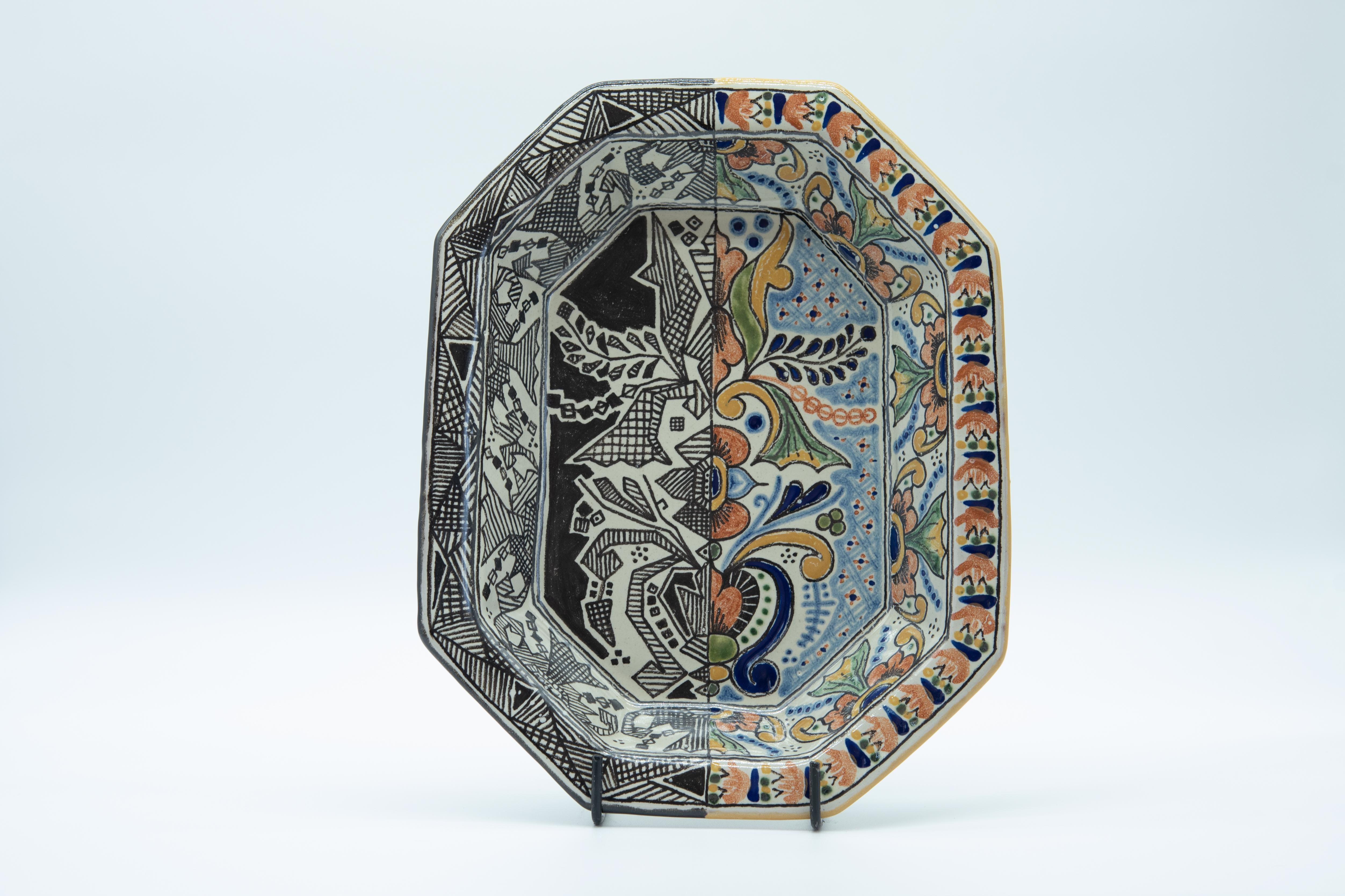 Elegant modern bowl made with the Talavera technique. Artist, Cesar Torres portraits the colonial art of Mexico with a modern twist. He has been bringing new ideas to his father's traditional work for the past years. 

The Talavera is not just a