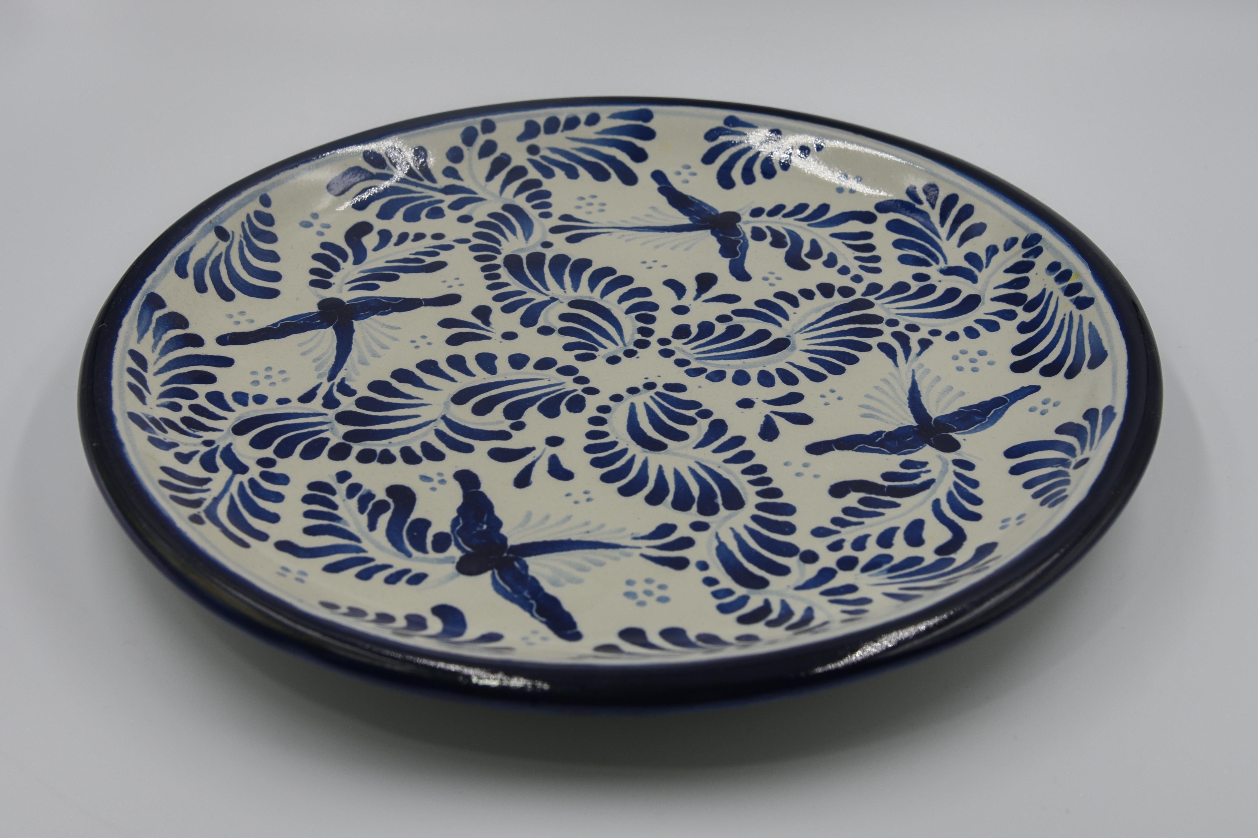 This decorative Talavera plate is a contemporary example of Talavera today. Artist Cesar Torres unmasks the past and portraits the present in a vide-poche -- rustic Mexican elegance. 

The Talavera is not just a simple painted ceramic: its exquisite