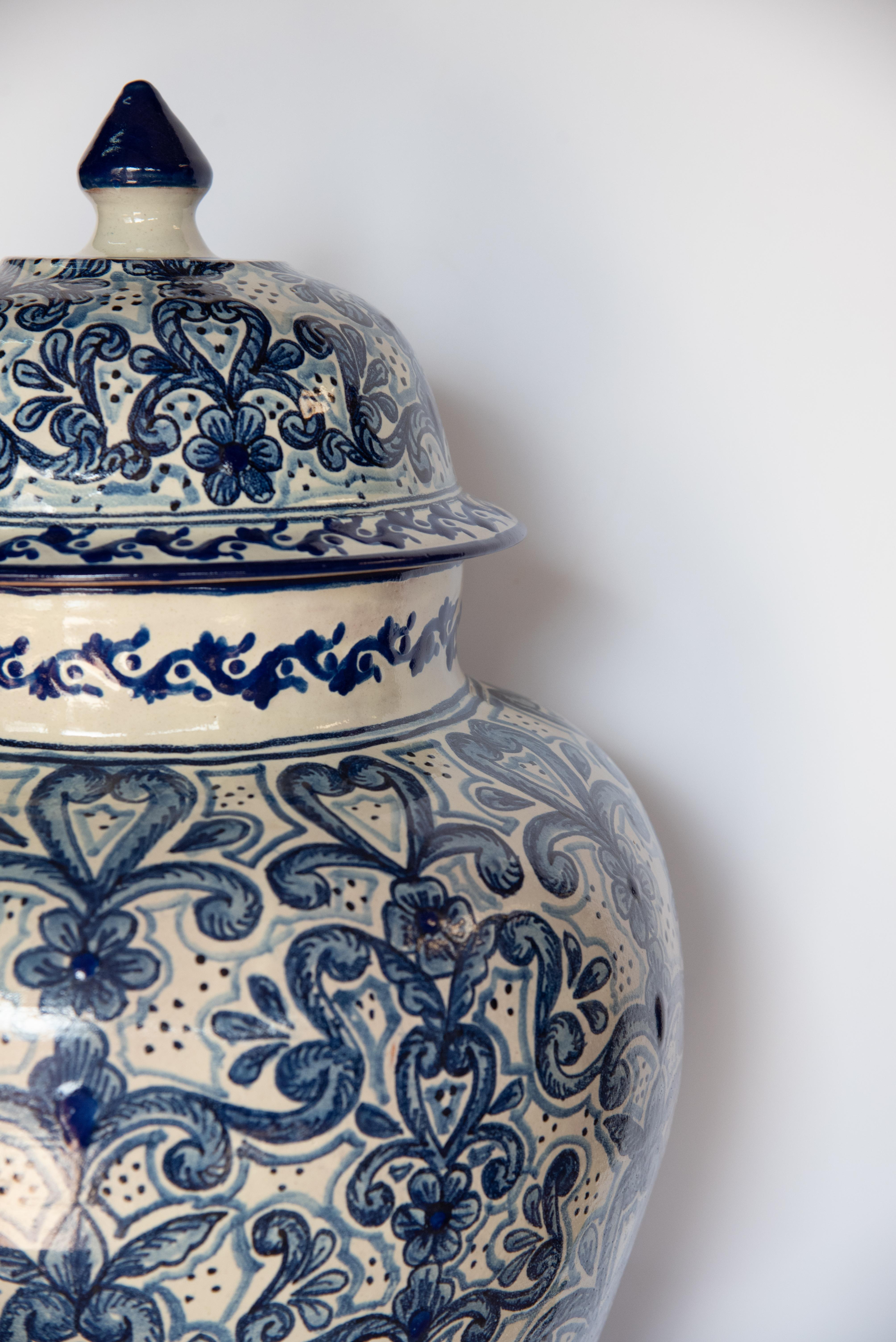 This one of a kind vessel is a collector's item by Talavera artist, Cesar Torres. The vase figure comes with a pointy lid just as a traditional Talavera vase, its texture and design are however a mixture of colonial and contemporary design. 

The
