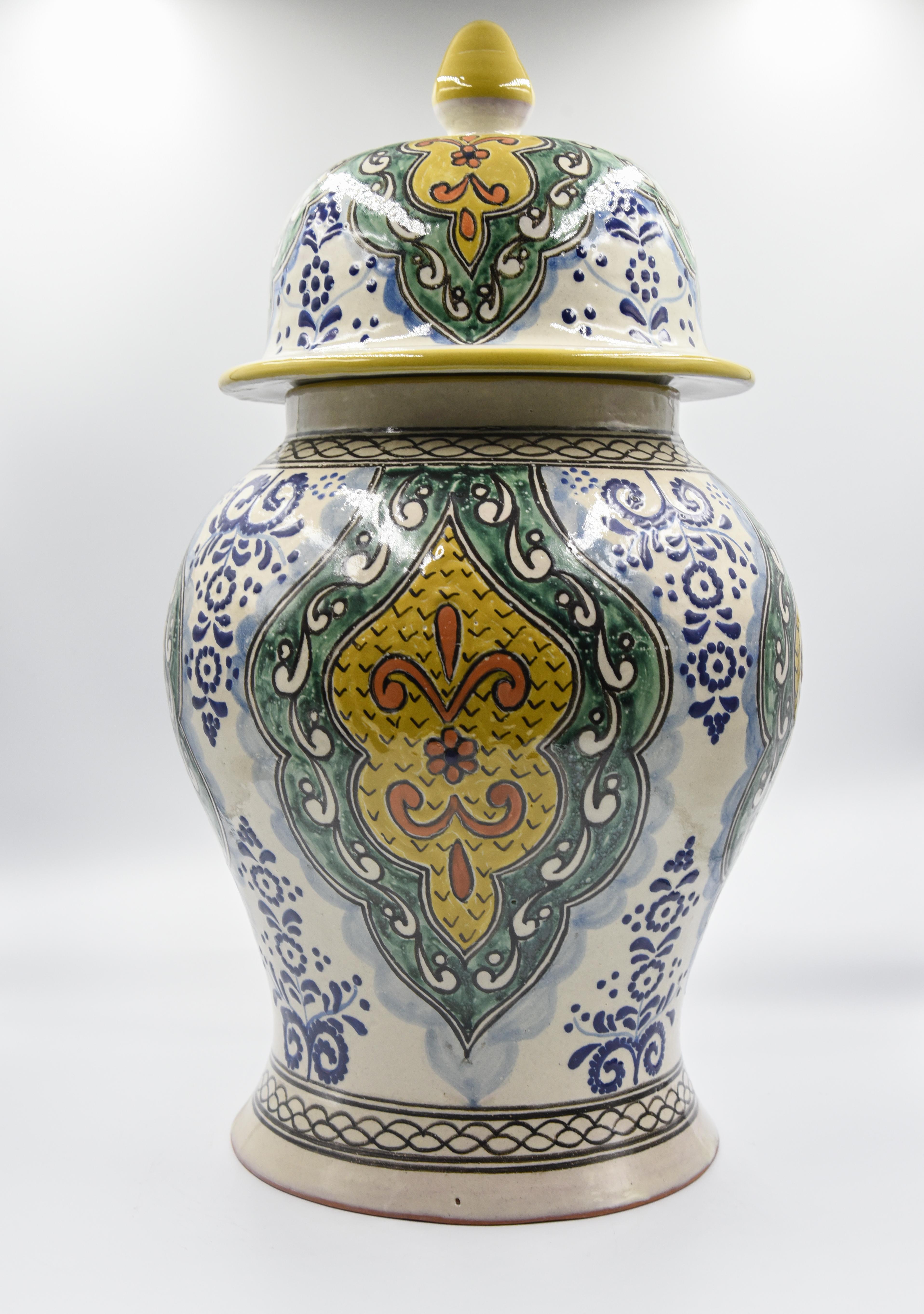 This impressive one of a kind vase is a true representation of Cesar Torres's work. This beautiful vase figure comes with a pointy lid just as a traditional Talavera vase. Its texture and design are however a mixture of colonial and contemporary