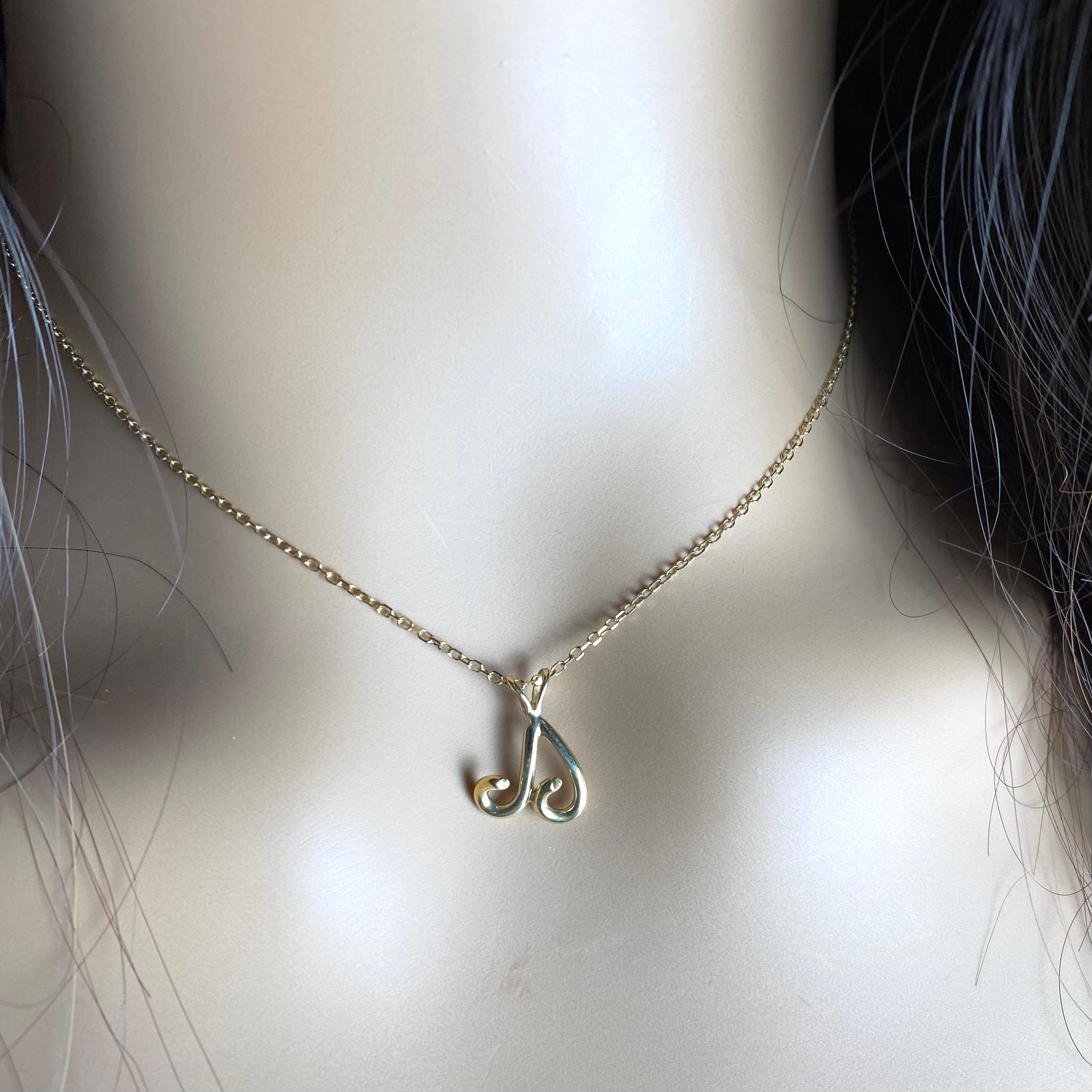 Authentic Tiffany Co 18K Yellow Gold Vintage Aries Ram Zodiac Pendant Necklace In Good Condition In New York, NY
