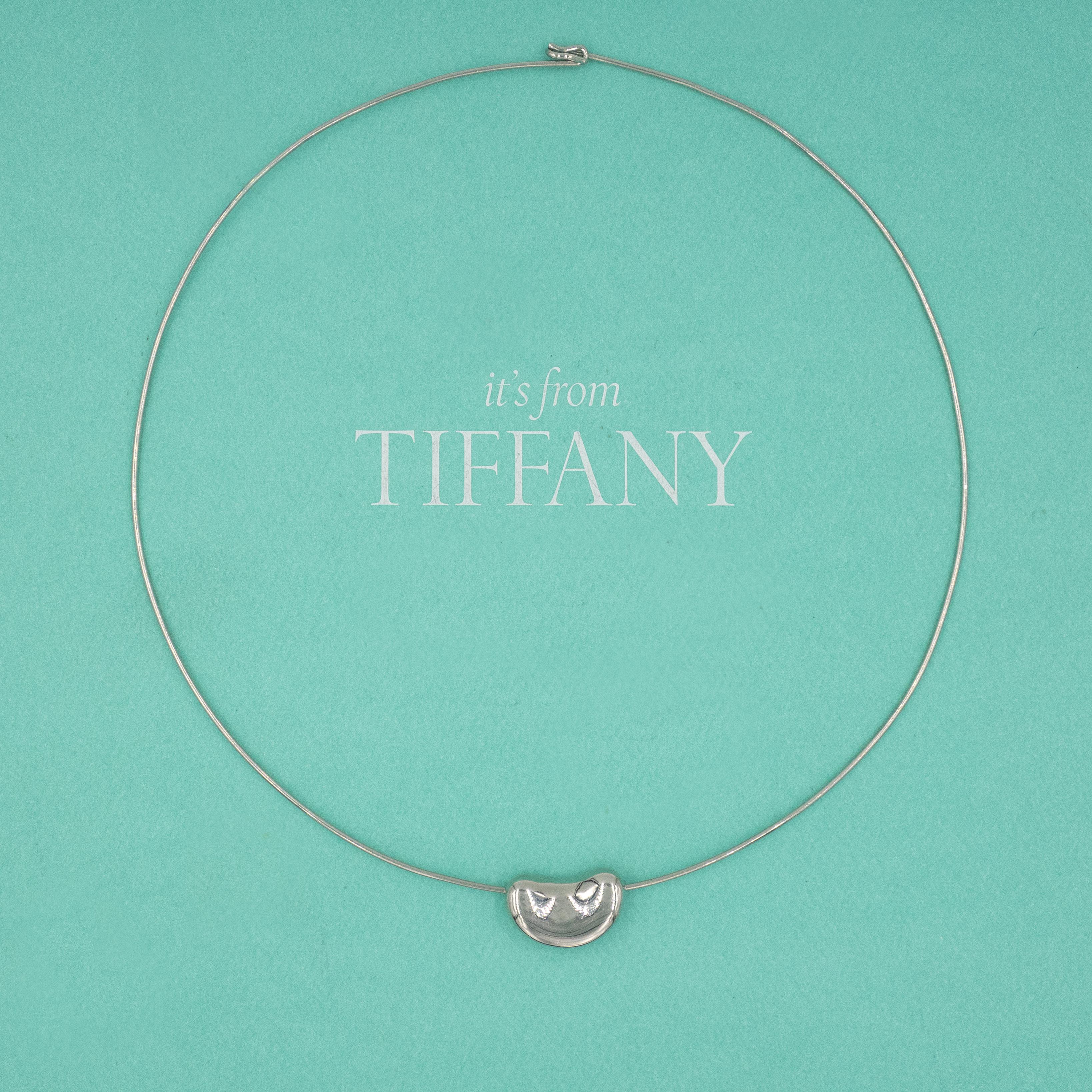 Rare Authentic Tiffany & Co. Elsa Peretti platinum Bean® wire necklace
Bean pendant slides along wire double end hook clasp
This piece was recently serviced by Tiffany
Currently not in production

Size:  40cm ( 15.75”)

Approximate Gross Weight:
