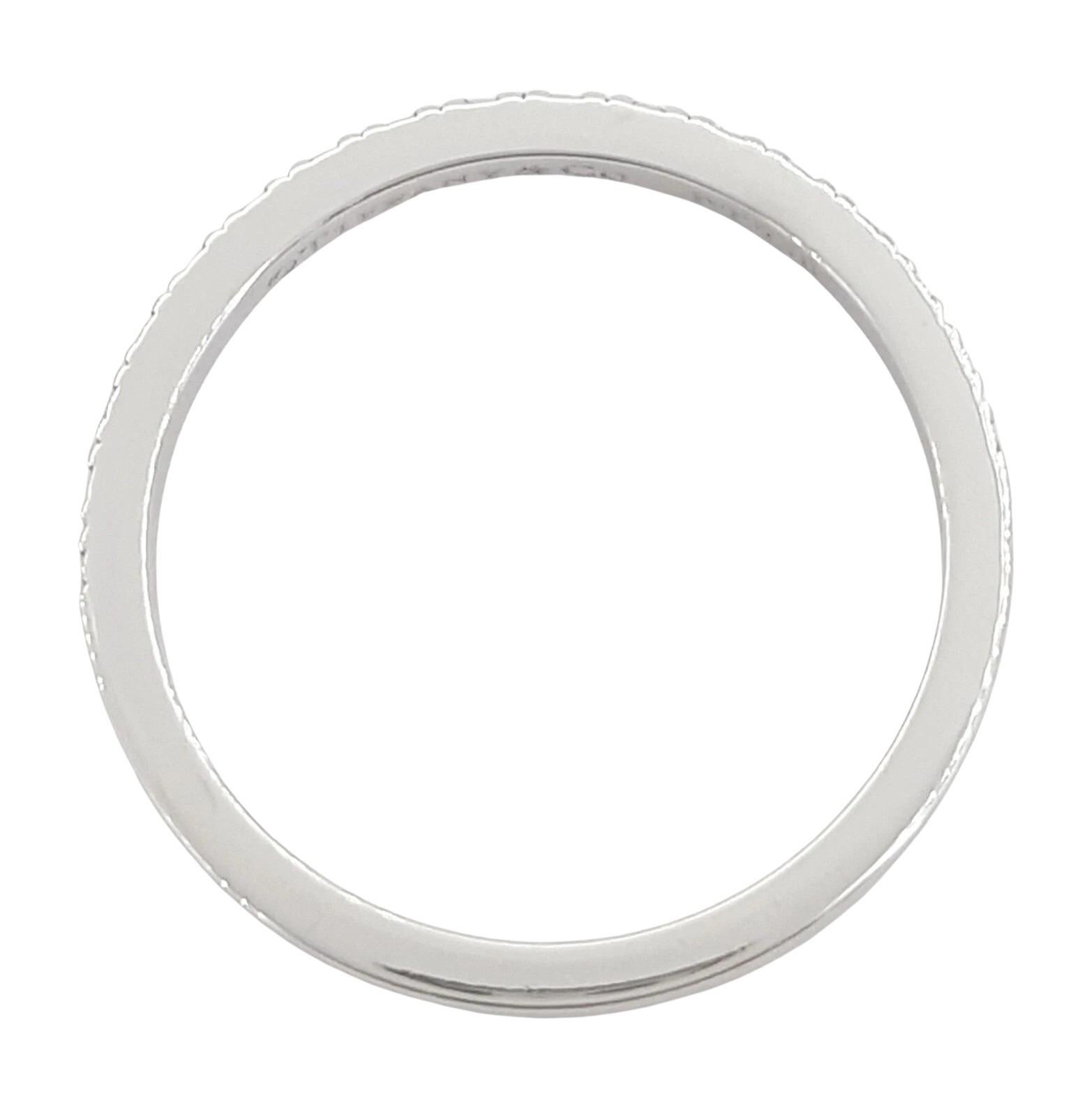 This elegant Tiffany & Co. Novo® wedding or anniversary band is crafted in platinum and set with 17 natural round brilliant cut diamonds totaling approximately 0.25 carats. The diamonds are exceptionally fine, graded E–G in color and VVS–VS in