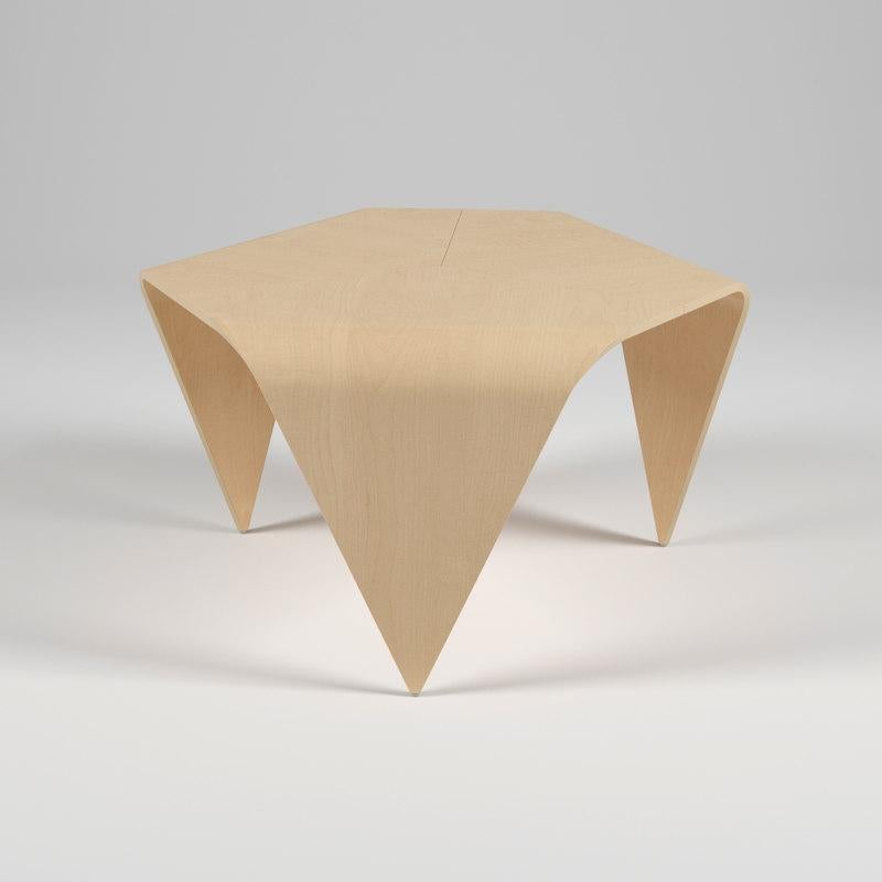 Authentic Trienna table in birch finish by Imari Tapiovaara & Artek. This incredibly distinctive table is formed from three sheets of pressed birch veneer. The hexagonal tabletop is supported by three triangular legs. The seams between the pieces