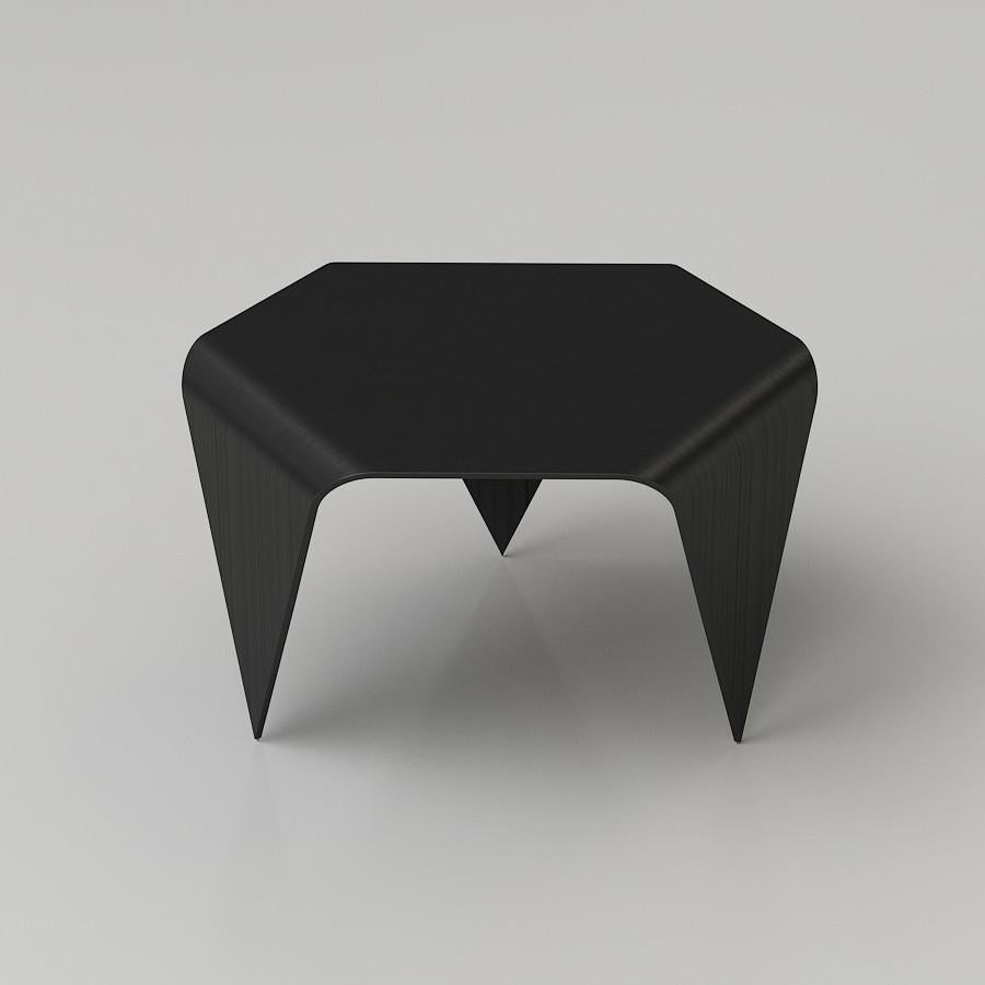 Authentic Trienna table in black stain by Imari Tapiovaara & Artek. This incredibly distinctive table is formed from three sheets of pressed birch veneer. The hexagonal table top is supported by three triangular legs. The seams between the pieces