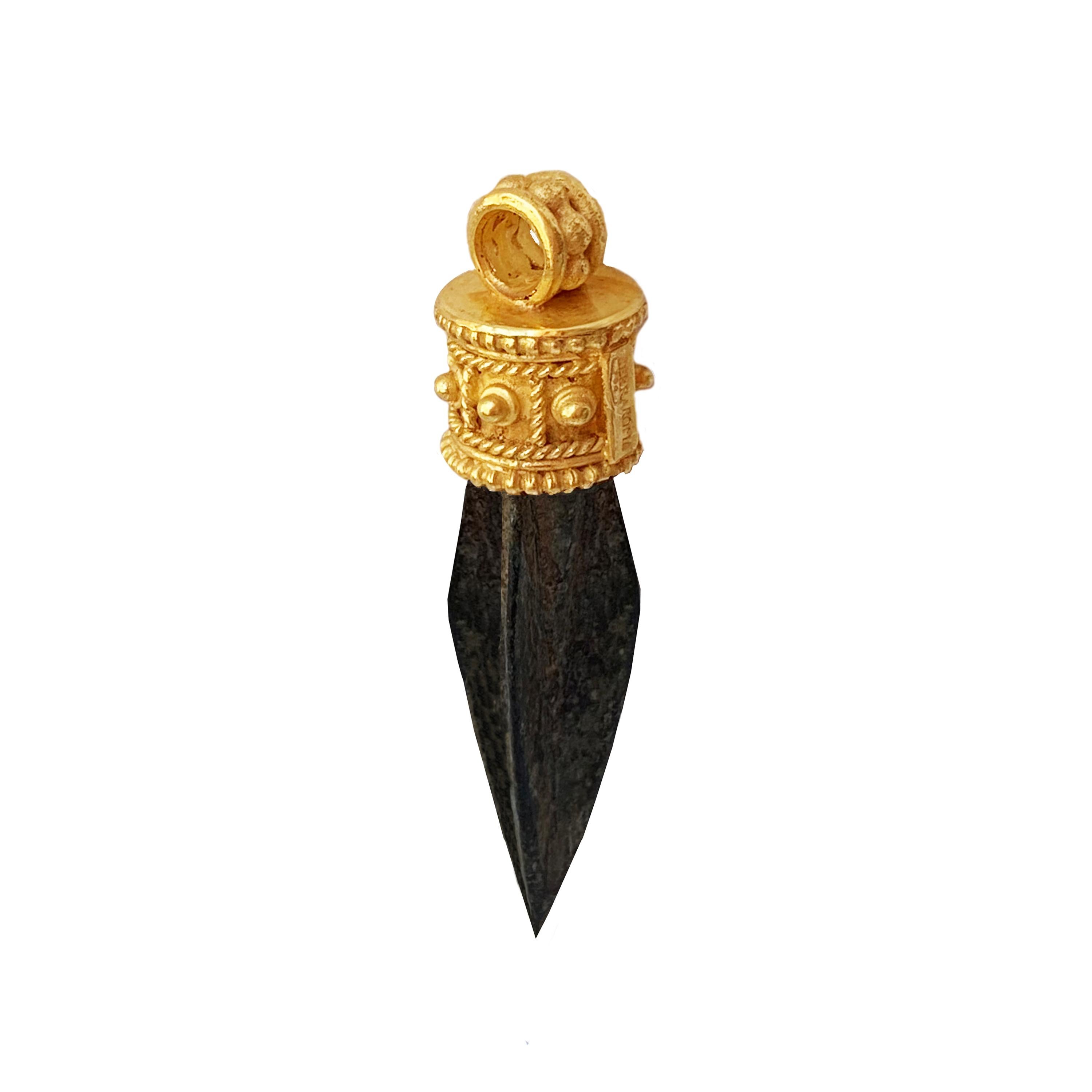 
This small bronze arrowhead, olive-green patina, is similar to examples found in the 
