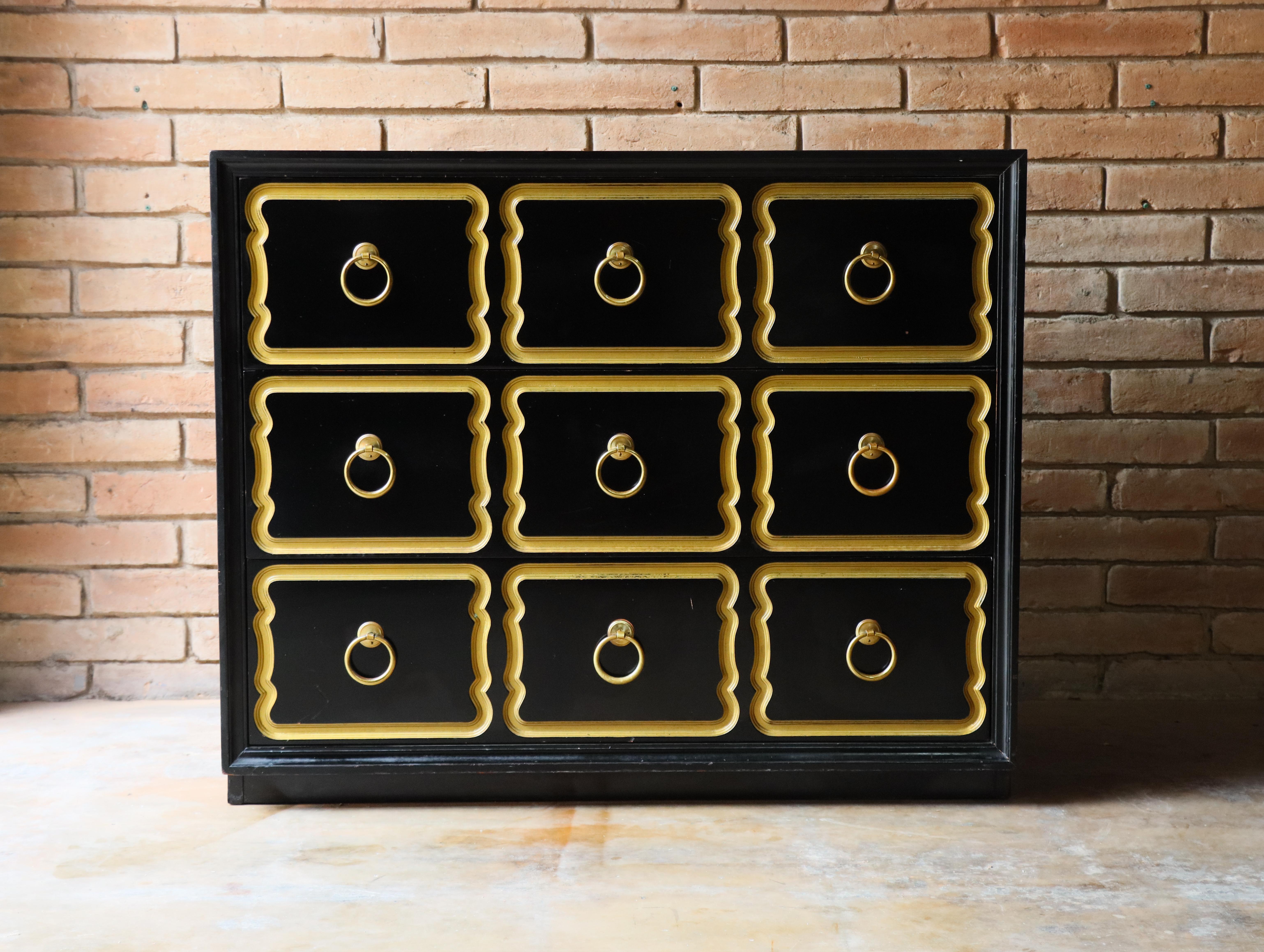 Authentic vintage ‘España’ chest of drawers designed by Dorothy Draper for Herendon / Heritage. Designed in 1955, this example is in black lacquer with parcel gilt and brass hardware. This one would be perfect for an entry way or little nook needing