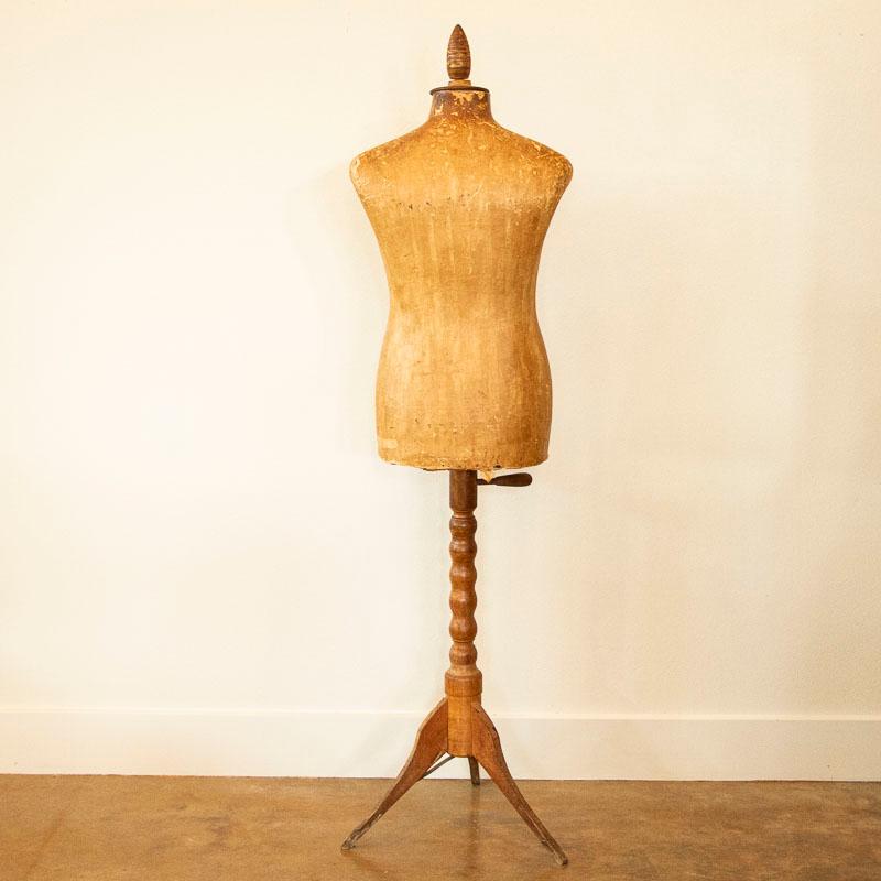 This dress form or mannequin was made of papier mâché, now aged, stained and tattered while showing off its authentic vintage appeal. The mannequin may be used to display all types of clothing, jewelry and more or simply use as a fun vintage accent.
