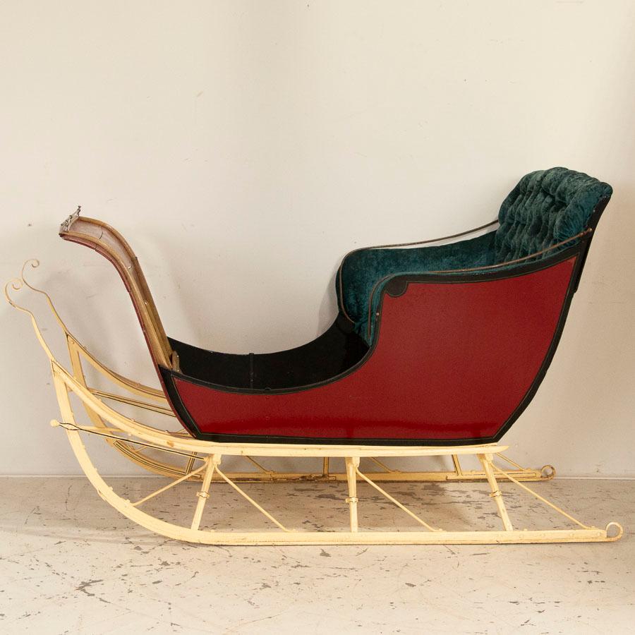 You can almost hear the sleigh bells ringing as you sit in this authentic, vintage sleight seat. All original red paint, yellow runners and green crushed velvet seat make one dream of snow and snuggling under a blanket. This sleigh is ideal for