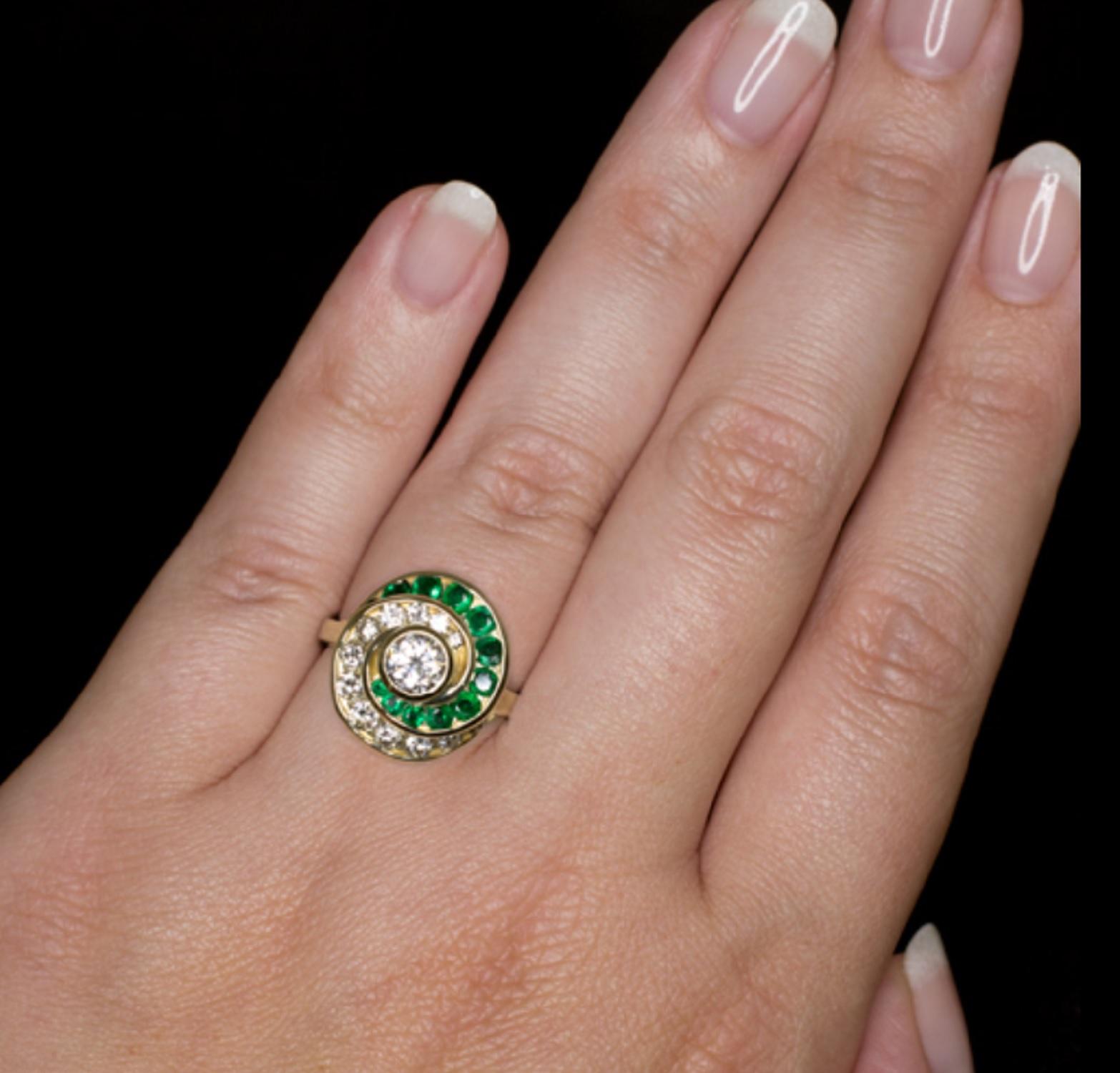Authentic Vintage Round Brilliant Cut Diamond Natural Emerald Cocktail Ring 
main stone approx weight is 0.50 carats is 100% eye clean and white
side diamonds also very clear and great color natural emeralds 
all set in 14 carats yellow gold