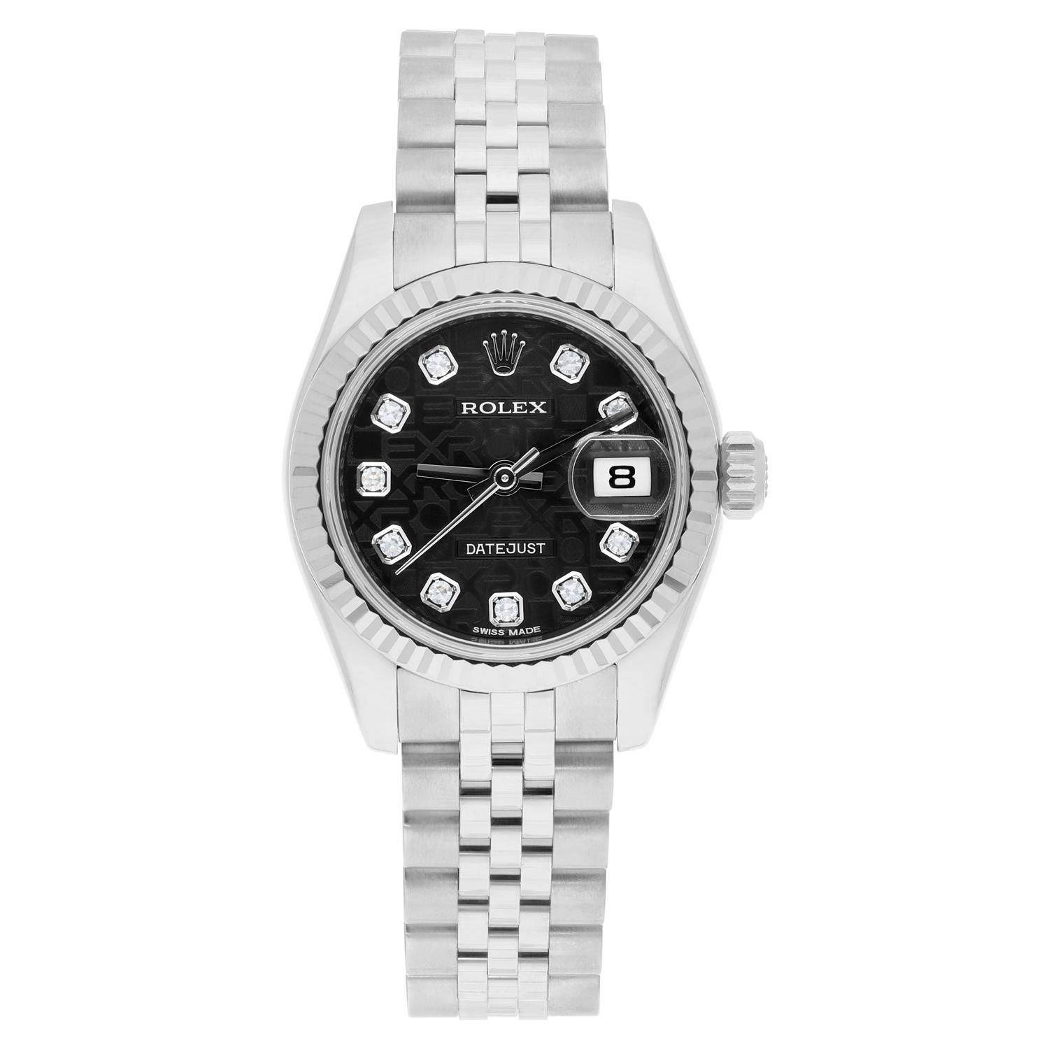 This authentic women's Rolex Lady-Datejust wristwatch is a luxurious timepiece that features a 26mm silver stainless steel case with a fluted fixed bezel. The dial pattern is a Rolex Jubilee with diamond markers. The bracelet has a hidden fold clasp