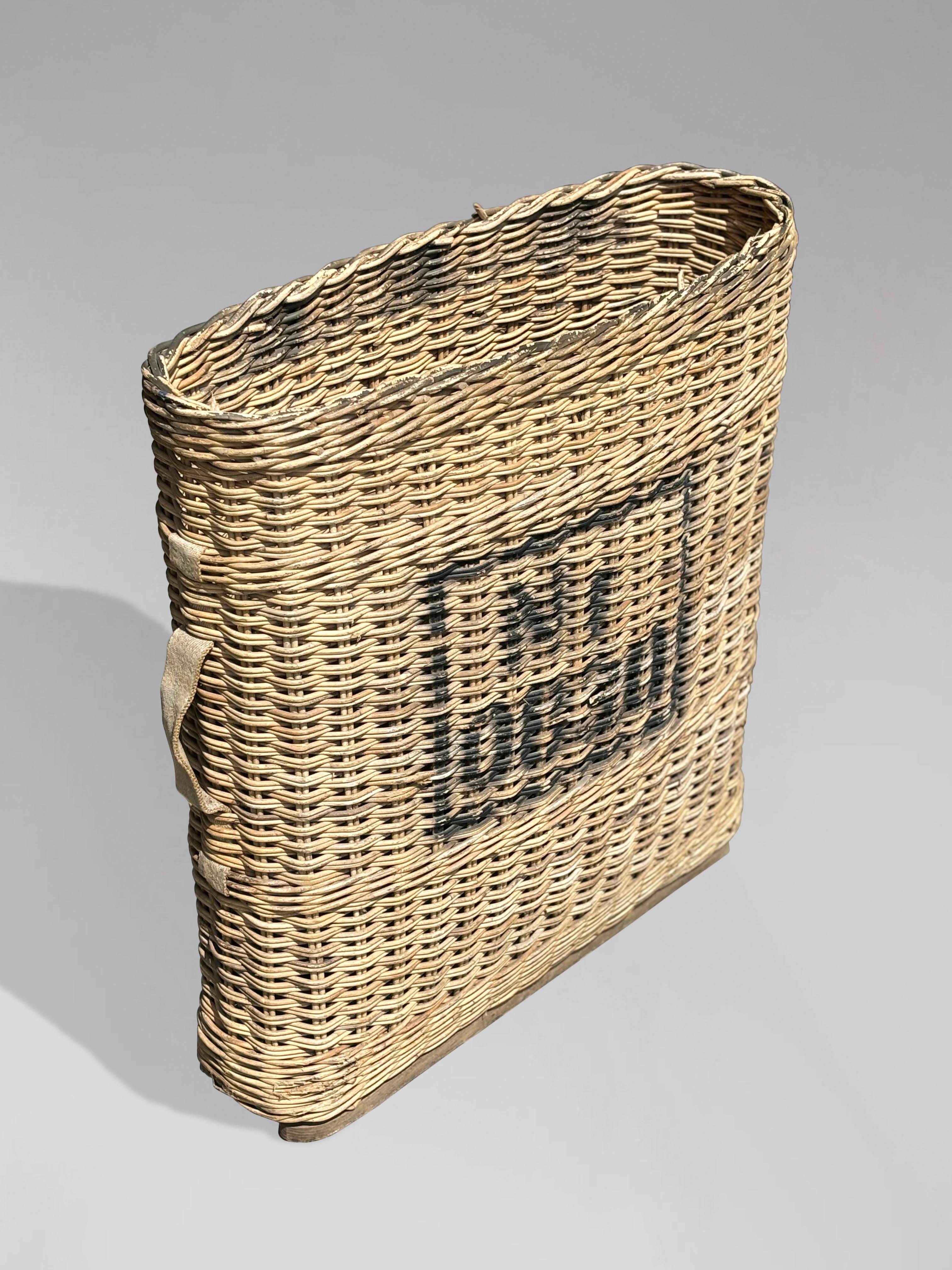 This authentic WW2 NR 0830 artillery shell wicker basket carrier, complete with a sturdy wooden base and canvas handles. Originally designed during World War II in Switzerland, this rare find once held ammunition tubes, as indicated by the painted