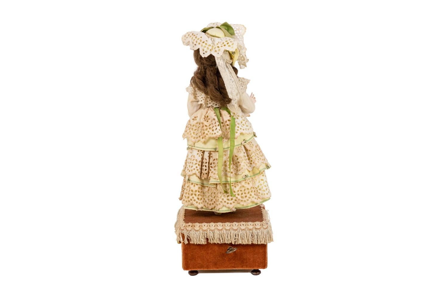 doll on a music box costume