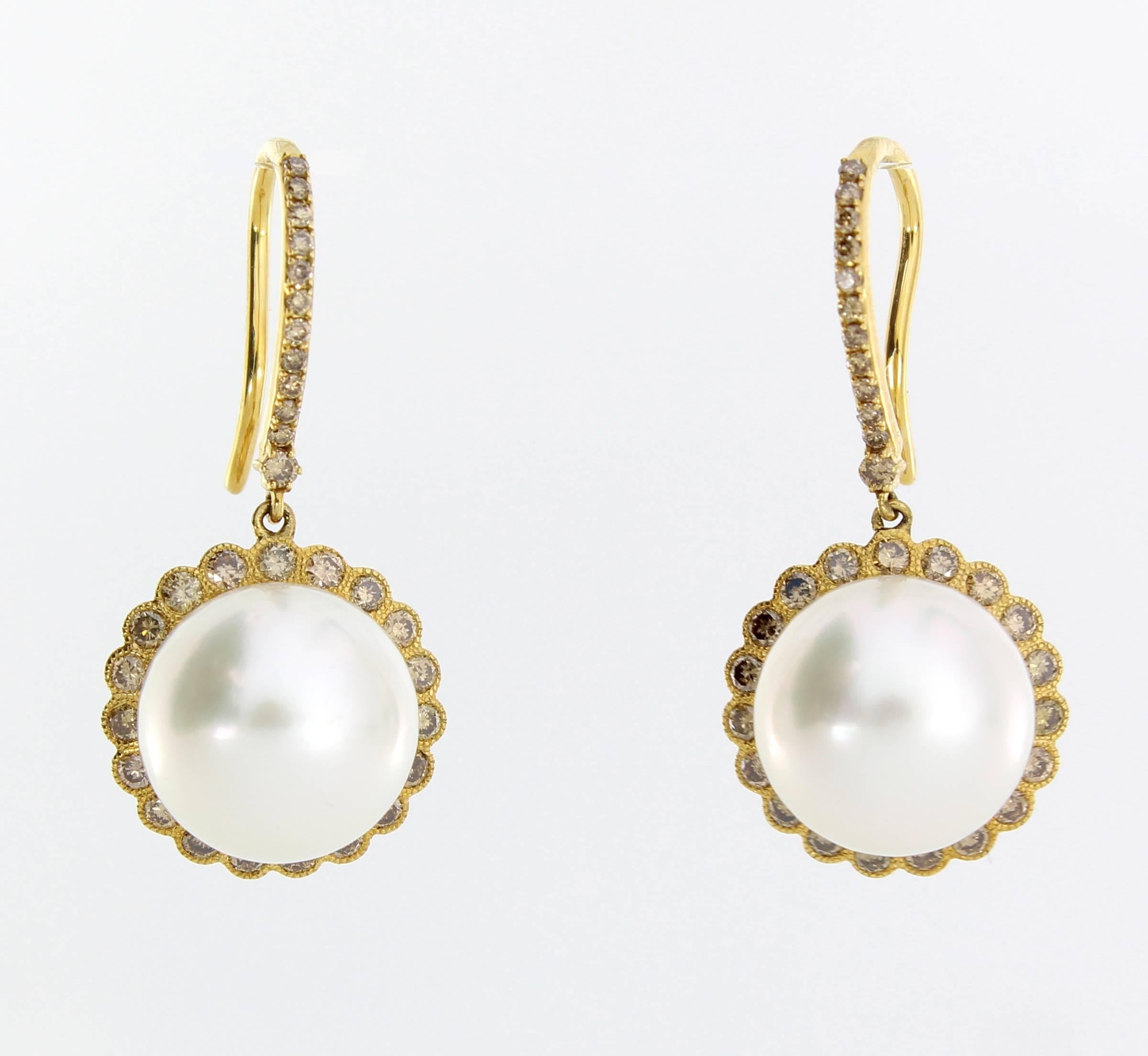 The Sphere Earrings are from the AUTORE Timeless Collection. 
This piece is crafted in 18k Yellow Gold with Brown Diamonds (1.16ct) and 12mm White High Button South Sea Pearls. 