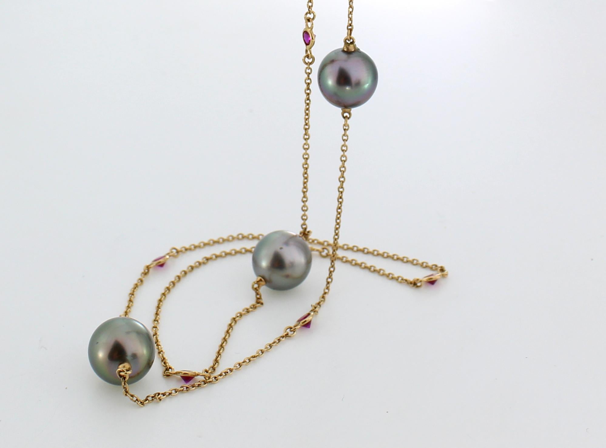 18k Rose Gold with Rubies (1.096ct) and 10mm Dark Green Round Near Round Tahitian Pearls (4 pieces). 