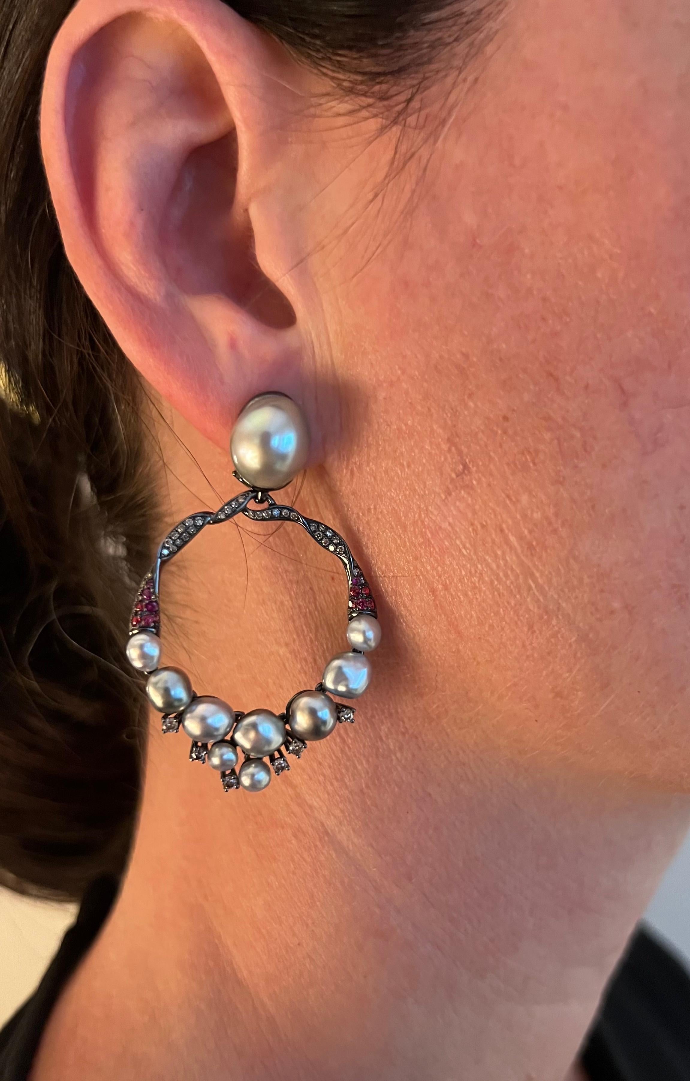 Autore South Sea pearls, spinels, brilliant cut brown diamonds, and 18-karat black rhodium gold earrings.  Marks: 750, AUTORE. These earrings are sold with a certificate. 

It’s all about pearls this year, and these feminine, romantic, and elegant,