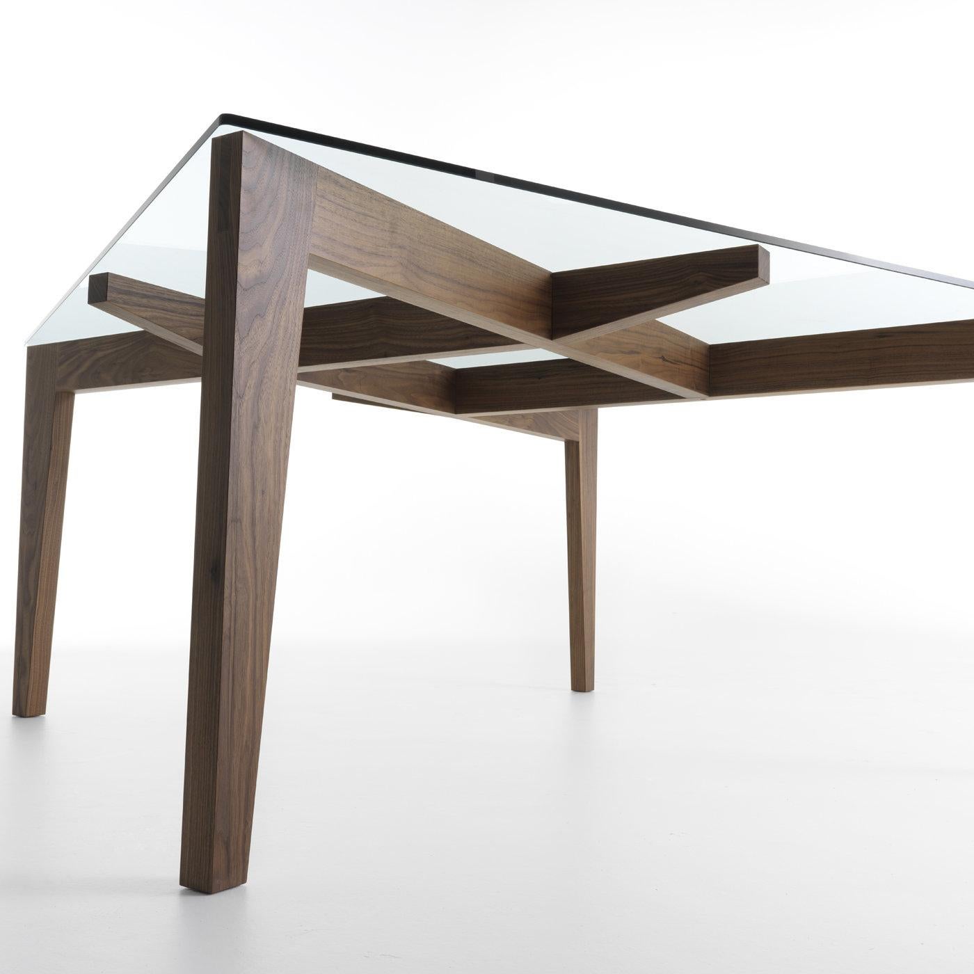 A striking sculptural work of art designed by Patrizia Bertolini, this dining table is named after the innovative structure that allows it to firmly stands on its own (