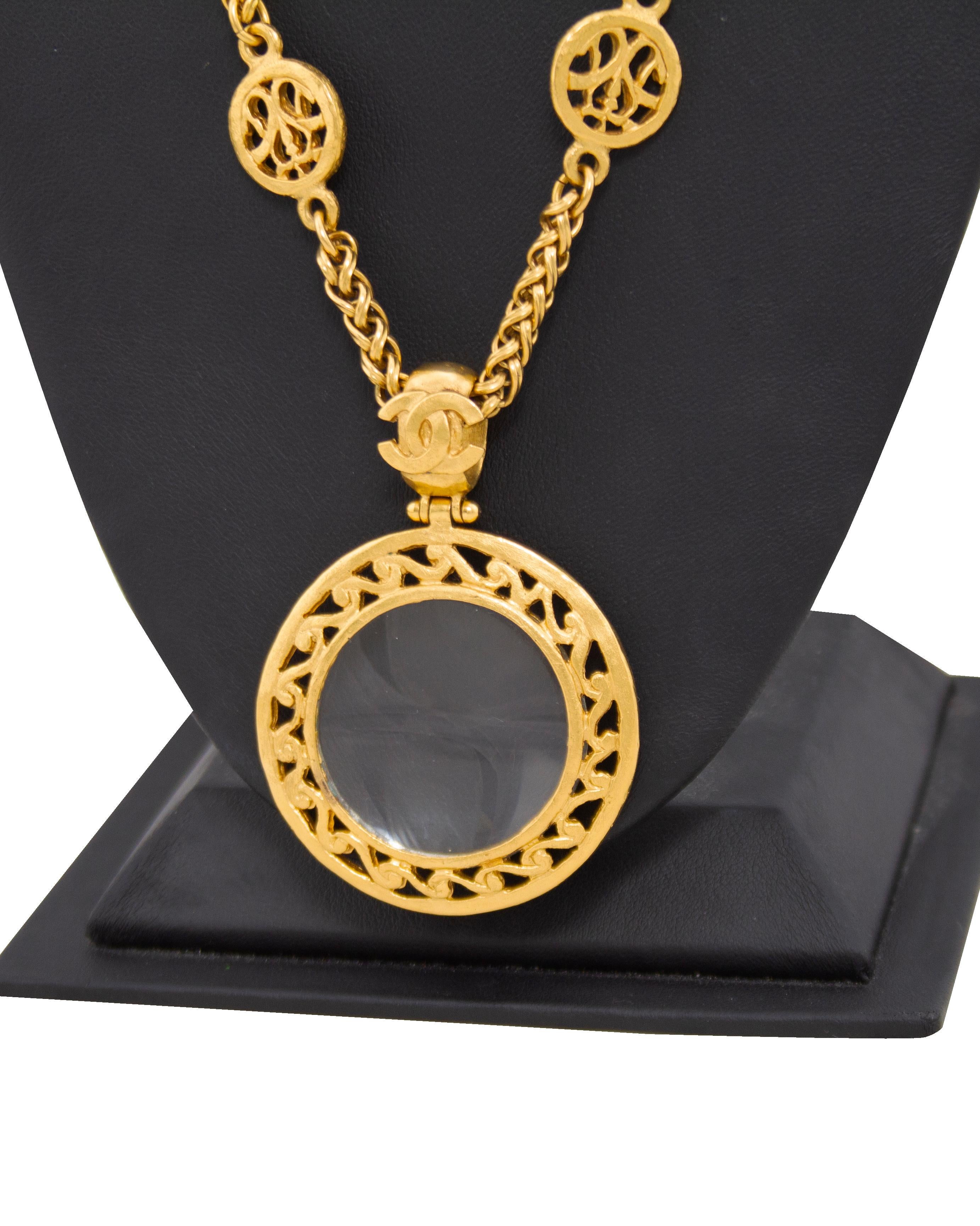 Chanel gold tone loupe from the autumn 1995 collection. The long chain link necklace features intricately detailed 0.75