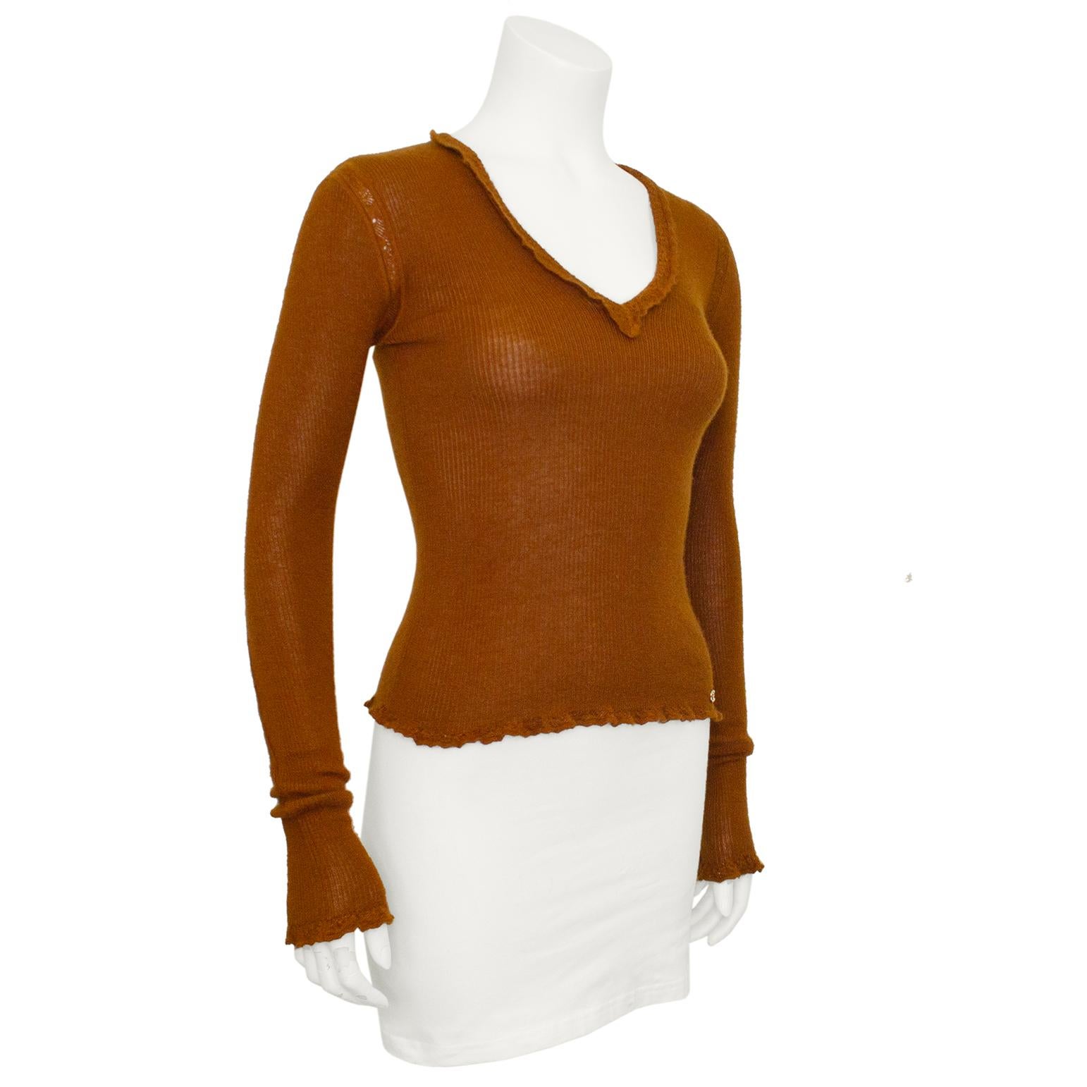Chanel rust brown cashmere and silk blend v neck sweater from Autumn 2003. Ribbed with crochet trim at the neckline, cuffs and hem. Very soft - 70% cashmere and 30% silk. Very long sleeves that scrunch at the wrist. Small interlocking CC logo at the