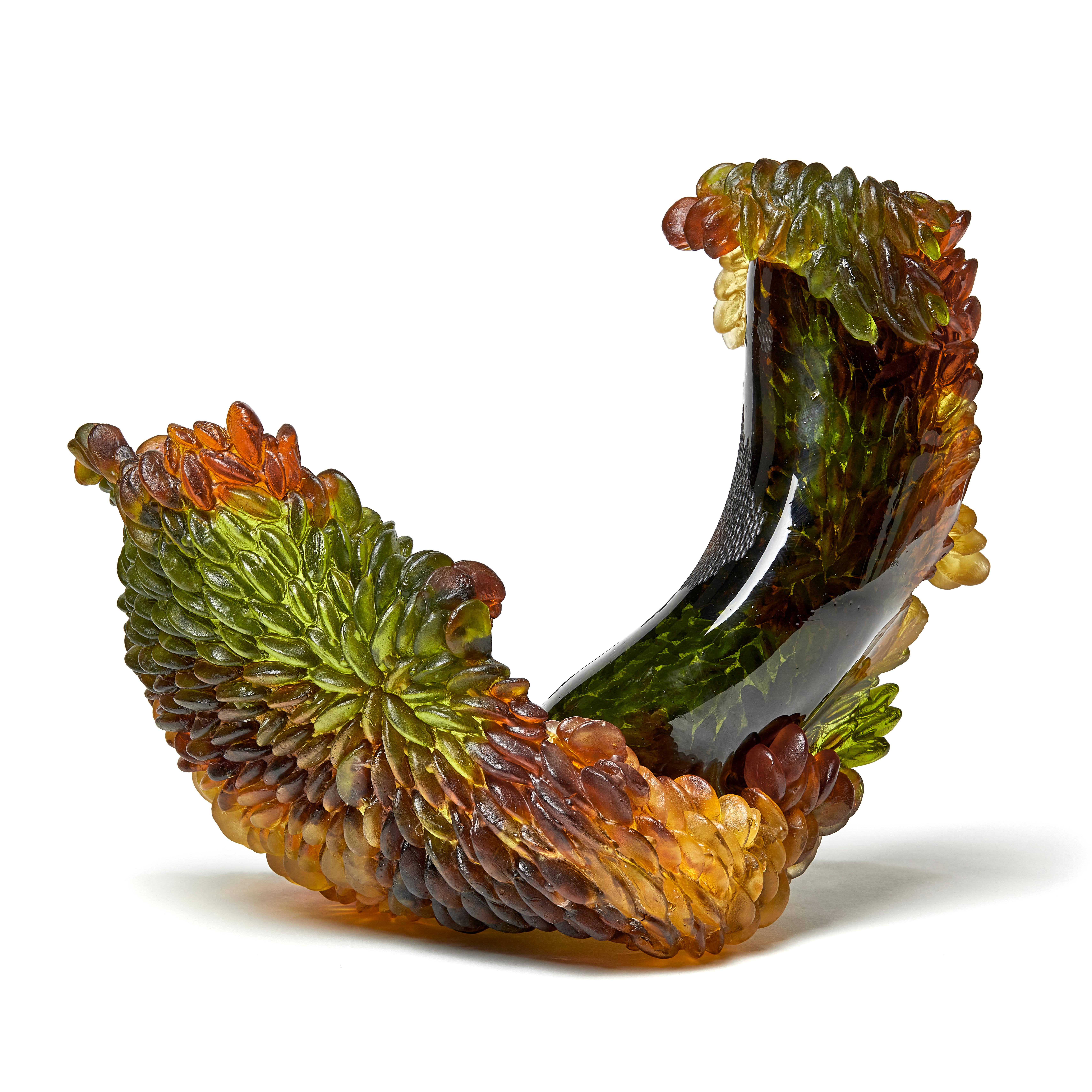 Autumn cherry is a unique textured glass sculpture in olive green, amber, rich brown and gold by the British artist Nina Casson McGarva. 

Casson McGarva firstly casts her glass in a flat mould where she introduces all of the beautifully detailed,