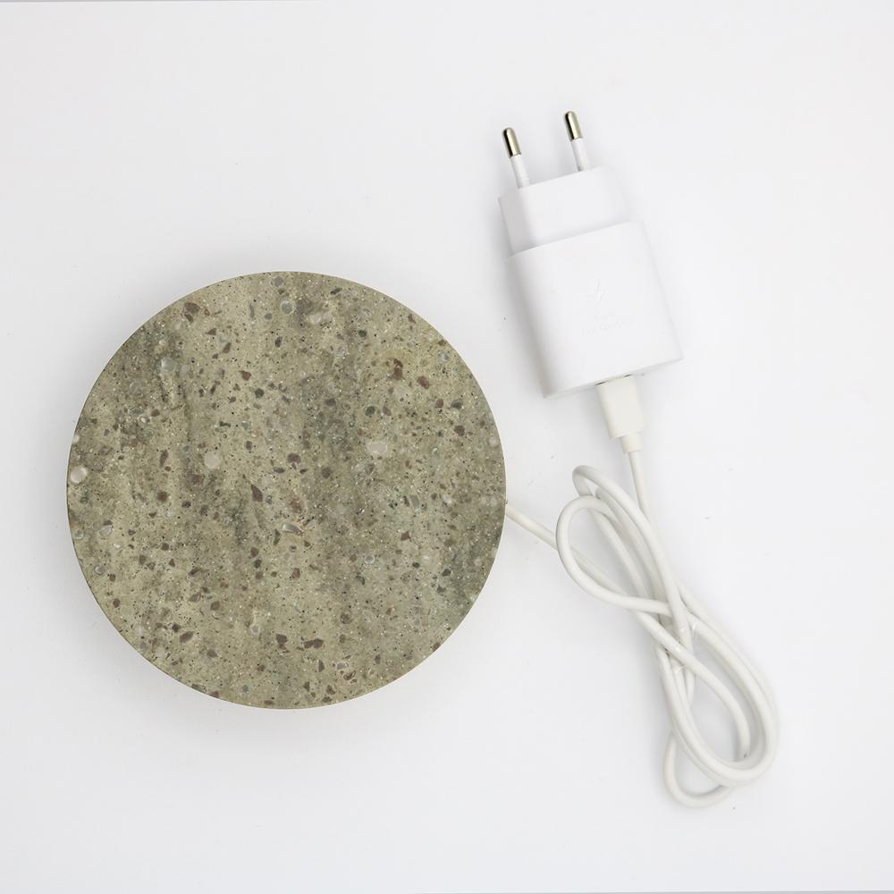 A corian base,
that quickly charges your phone, with a touch of magic.
 
A circle, 
a corian, 
realized with the care that marble requires.

A powerful wireless charging technology ensures an efficient and reliable power delivery.

The result is a