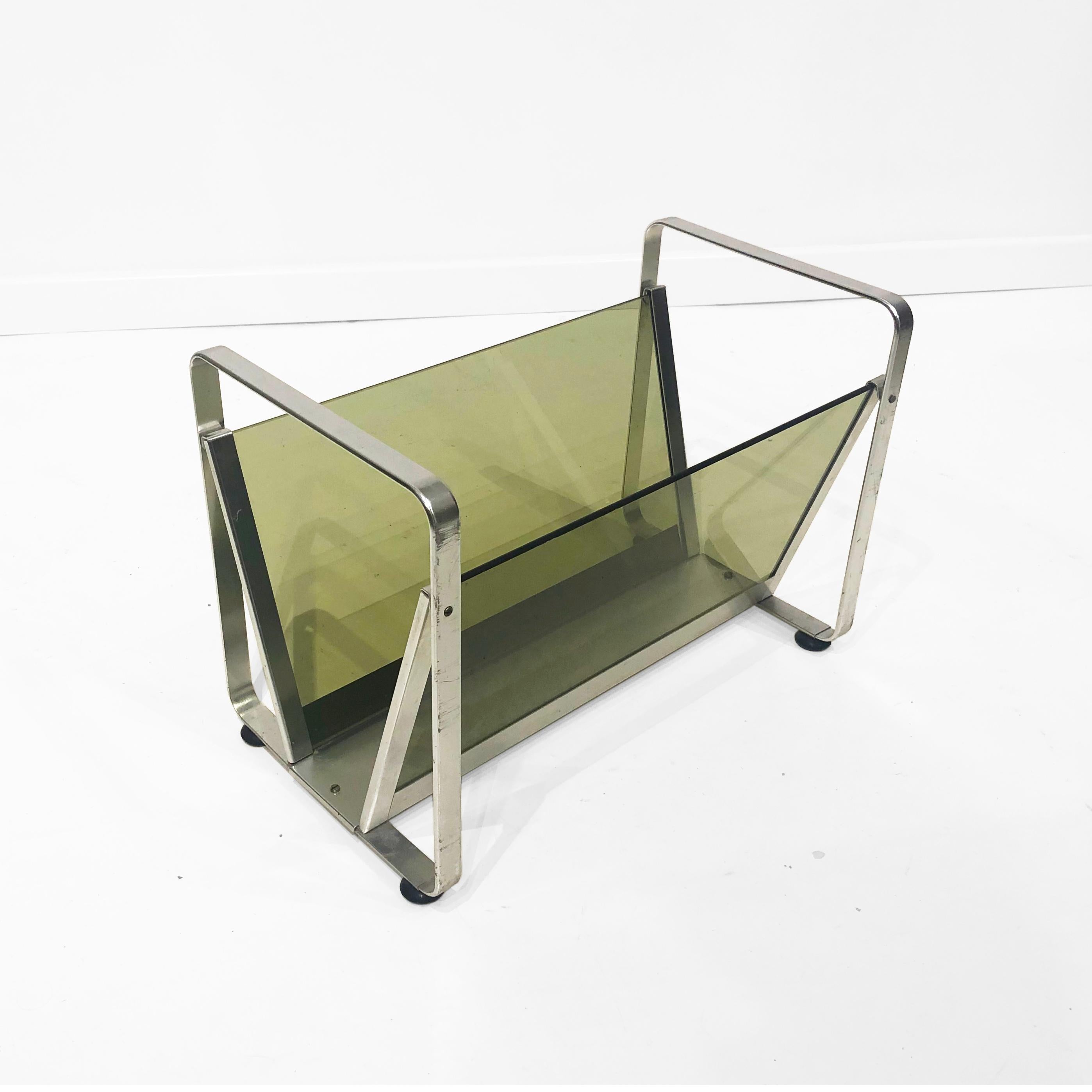 Space Age magazine or vinyl records rack in silver aluminium metal bended frame and smoked green glass. Light weight and easy to take around. AV Handwerk manufacturer's sticker is on the drinks cart.