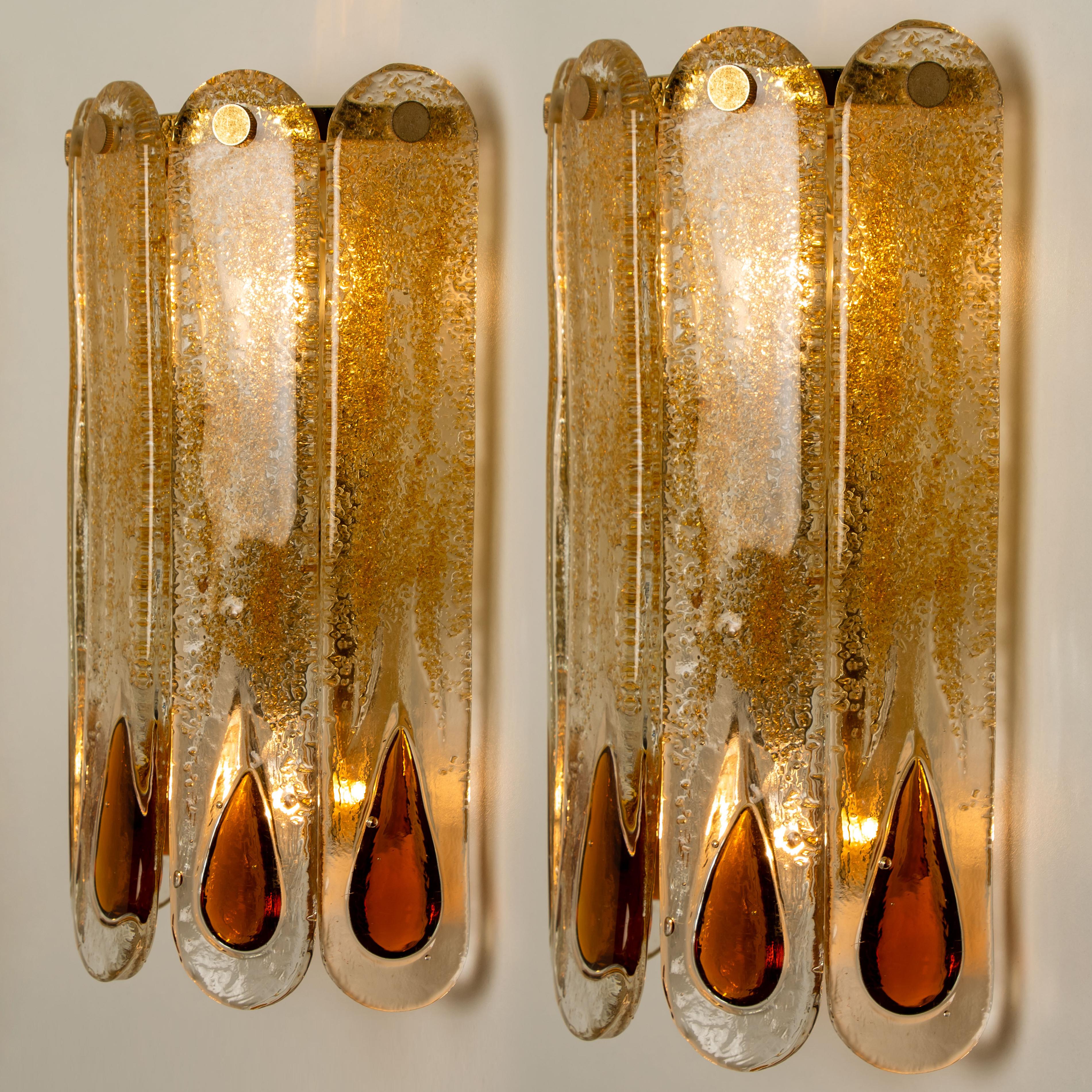 Beautiful amber tear drops wall lights designer: Carlo Nason (born 1935), manufactured by AV Mazzega, Murano, Italy. Brown, amber, orange and clear crystal hand blown Murano glass with brass frame. Flat rods inserted with real gold flakes of gold