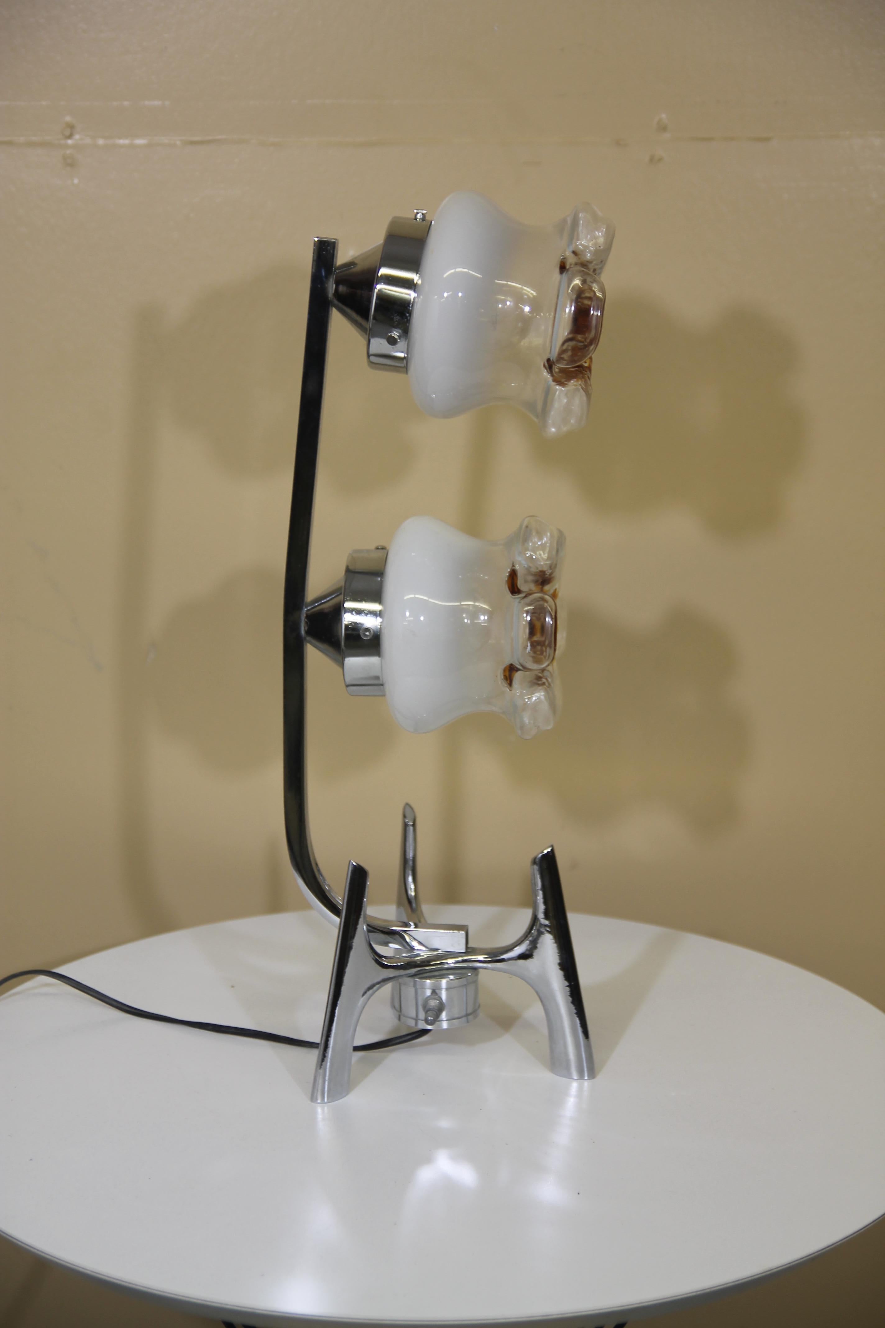 Great table lamp with hand blown shades by Mazzega. This is the only version of this lamp that I have seen. It has a three way switch which allows you to light the shades separately or both together. This is in nice vintage condition.