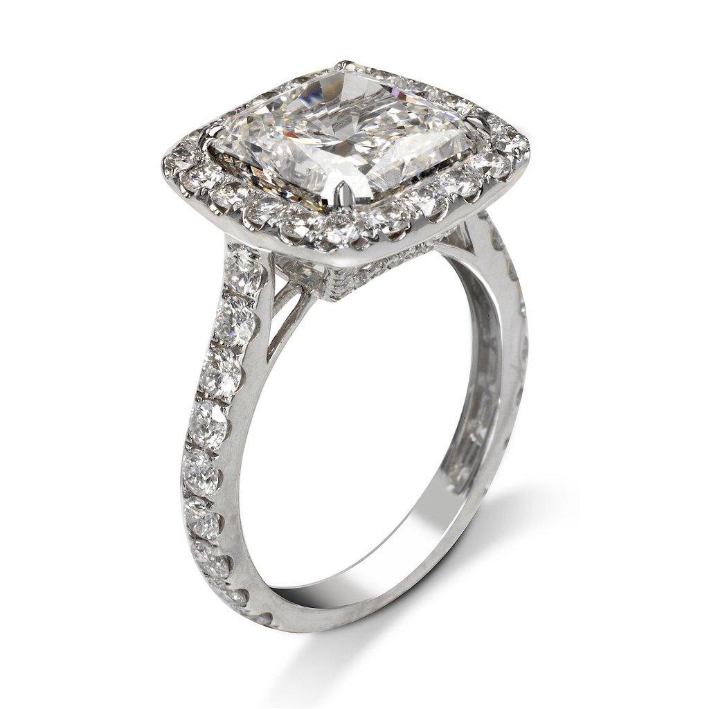 Ava is a beautiful radiant cut diamond ring created by Mike Nekta in NYC. 

Center Diamond:

Carat Weight: 5.20 Carat

Color: I

Clarity: VVS1

Shape: Radiant

Metal: 18K White Gold 

Diamonds: F Color, VS, 1.69 ct total

Size: Can be adjusted to