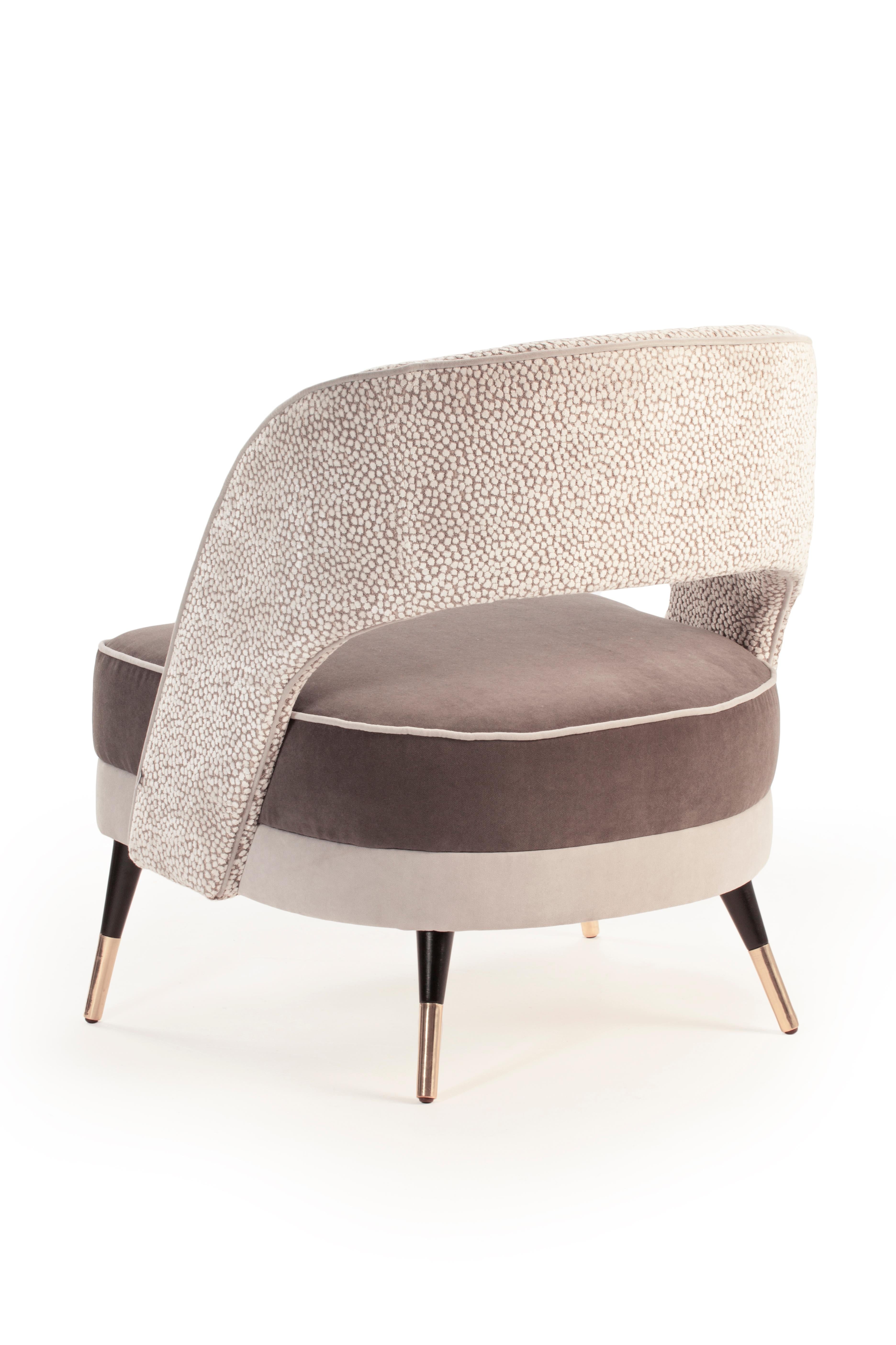 Comfortable and elegant, Ava armchair is a versatile piece where creativity meets no boundaries: fabrics, solid wood, lacquered wood and brass fittings are chosen and combined to produce the perfect combination to each space and concept. Made to