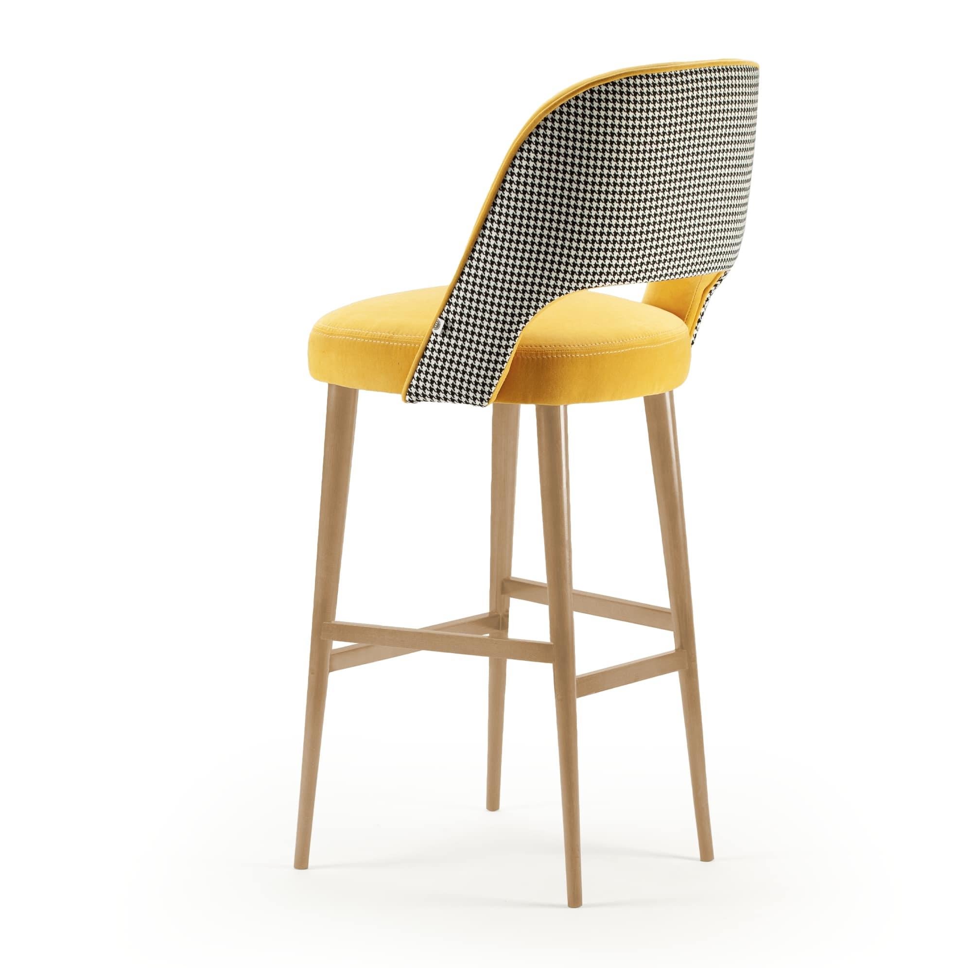 Comfortable and elegant, Ava bar stool is a versatile piece where creativity meets no boundaries: fabrics, solid wood, lacquered wood and brass fittings are chosen and combined to produce the perfect combination to each space and concept. Made to