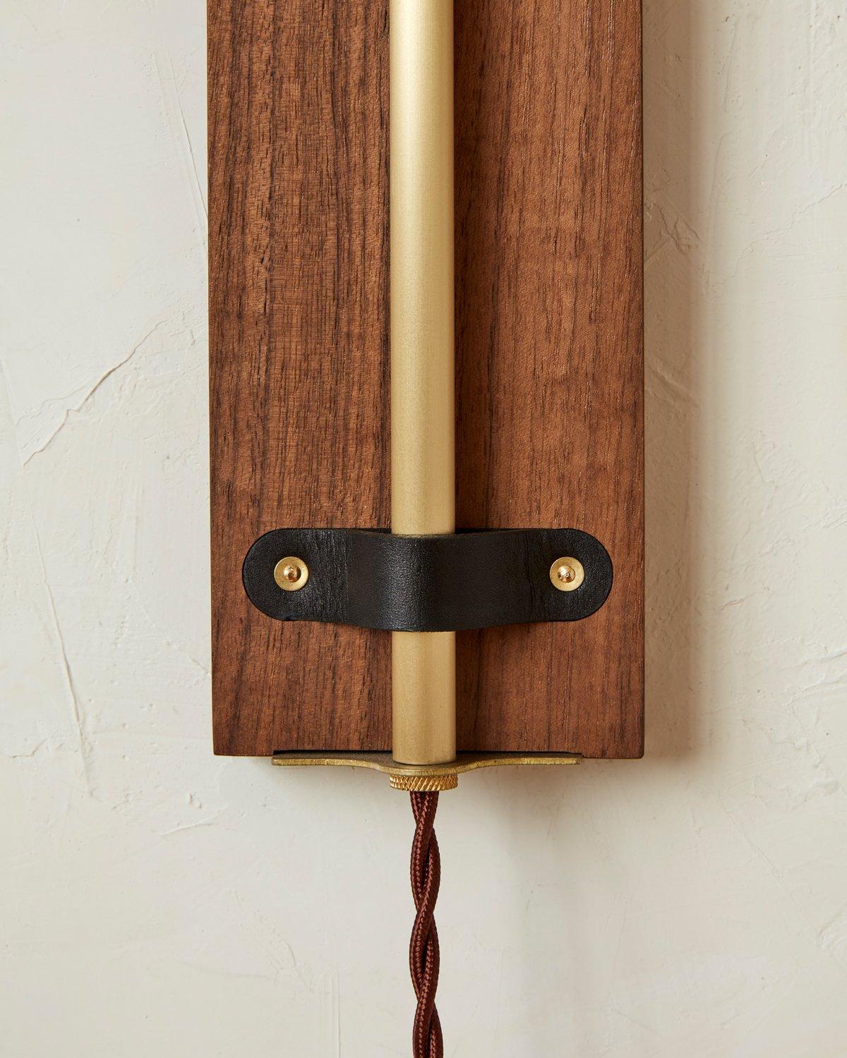 American Modern Brass + Walnut Ava Sconce in Black Leather, Plug in For Sale