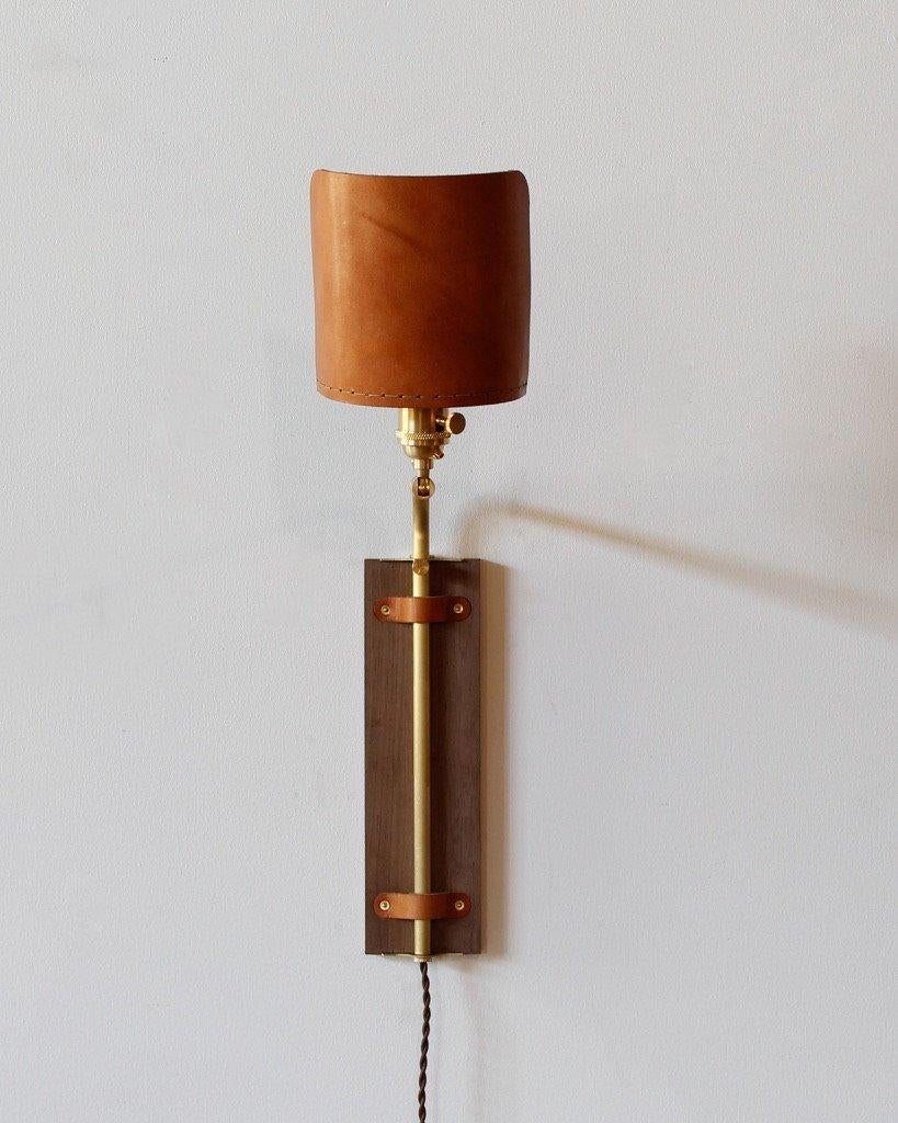 American Modern Brass + Walnut Ava Sconce in Tan Leather, Plug in For Sale