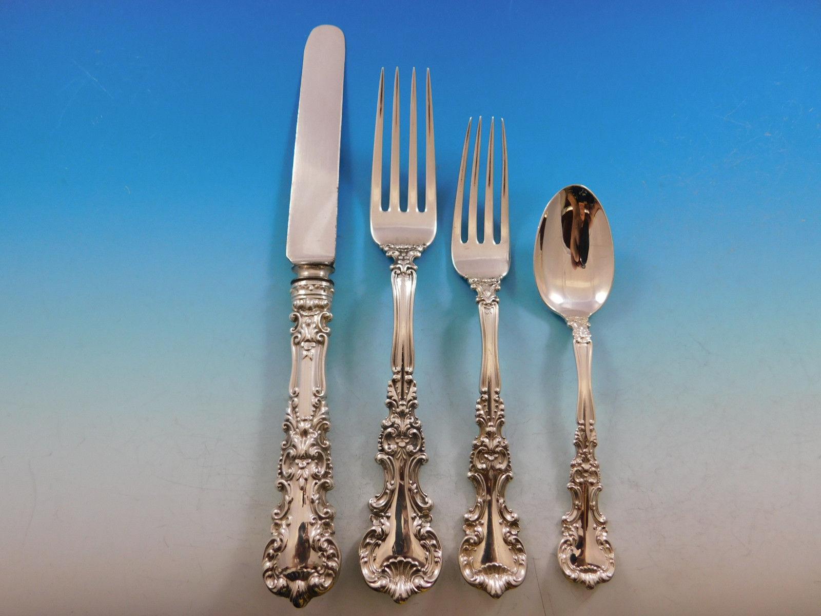 Gorgeous circa 1900 rococo and shell motif Avalon by International sterling silver dinner size flatware set - 84 pieces. This set includes:

12 dinner size knives, with stainless blunt blades, 9 1/2
