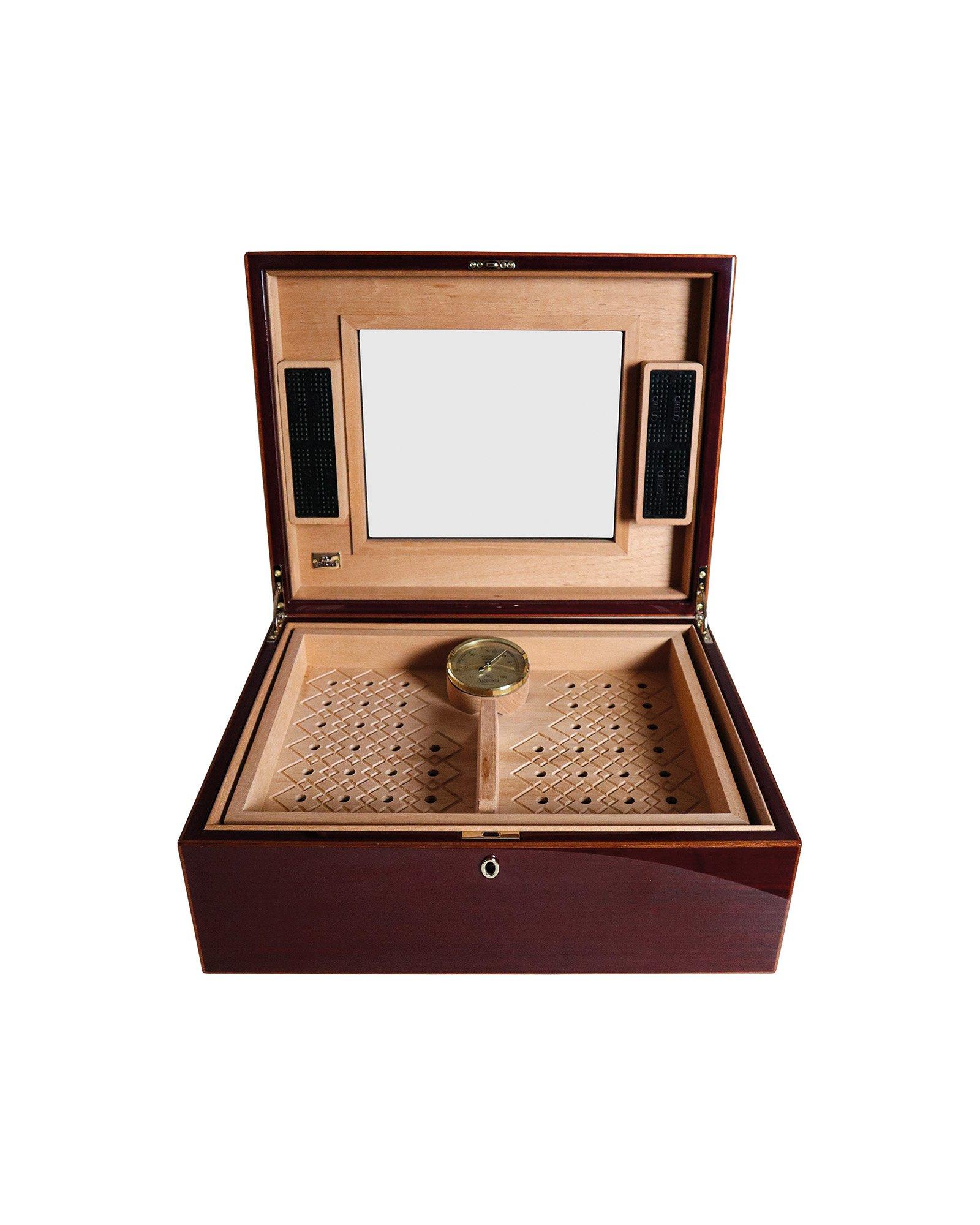 Humidor for 100 cigars in polished red oak and mahogany lining. Inside premium cedar. Two humidification units and hygrometer German made. Removable tray with engraved texture. Closing with lock with gold plated finish.