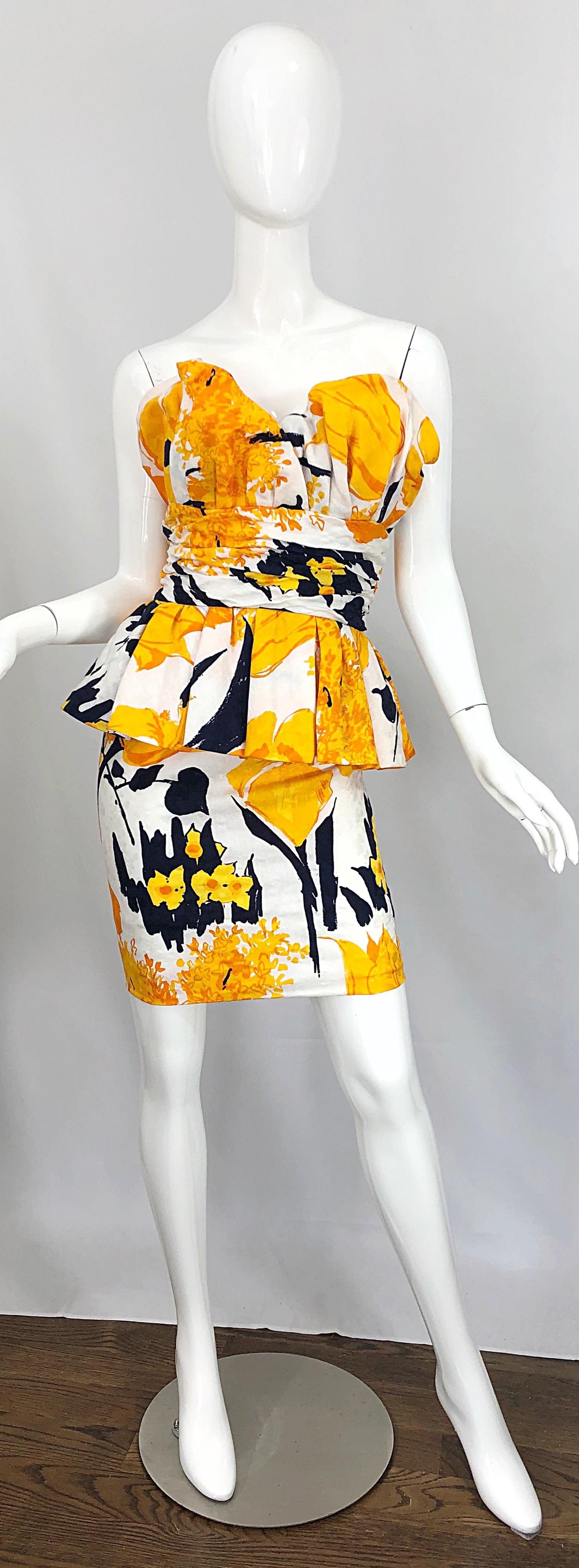 Avant Garde 1980s ARMEN WARDY yellow, black, marigold and white strapless silk mini dress! Features abstract flower prints throughout. Heavy attention to detail with built in support to hold everything in place. Flattering peplum at hips. Hidden