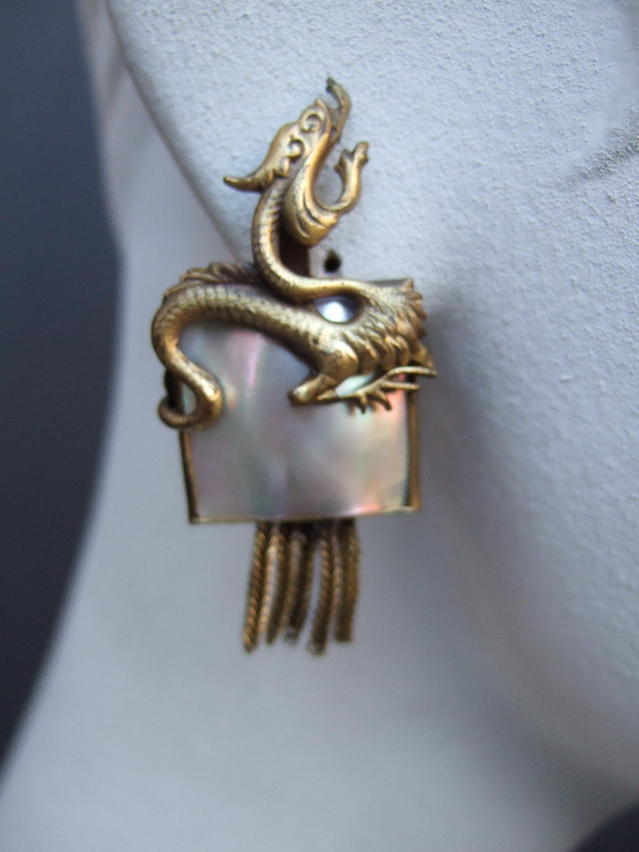 Egyptian Revival Avant-garde Brass Mother of Pearl Dragon Design Clip-on Earrings c 1960