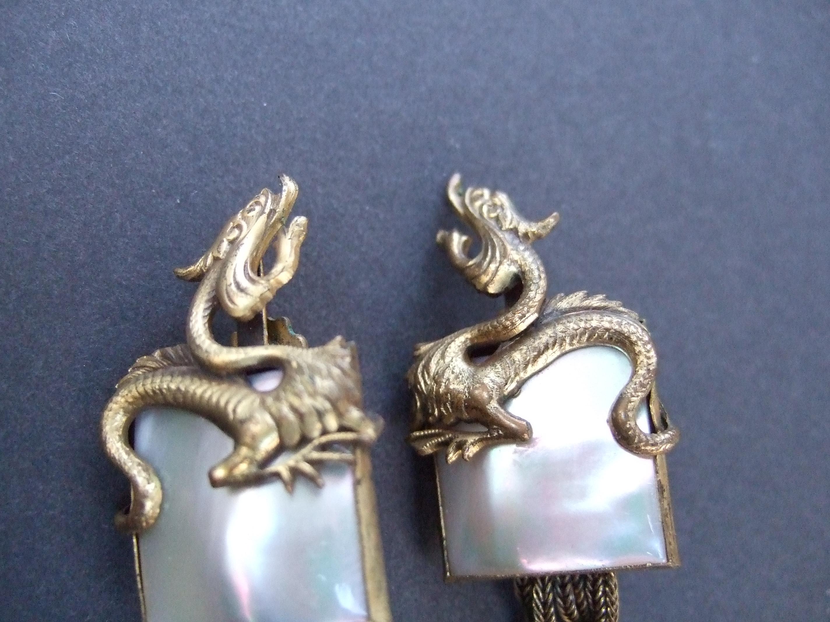 Women's Avant-garde Brass Mother of Pearl Dragon Design Clip-on Earrings c 1960