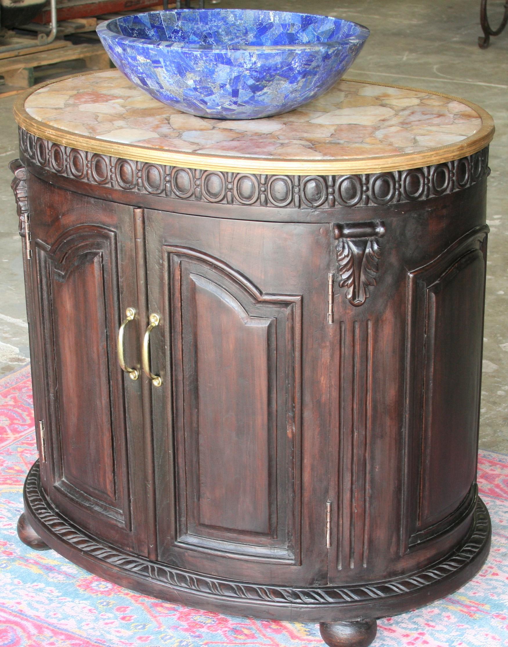 This extraordinary wedding gift was custom handcrafted and given as part of the gifts by the bride's family to the groom.
The oval shaped vanity is made of hand carved teak wood with inside painted in silver tone. It is supported on ball feet. The