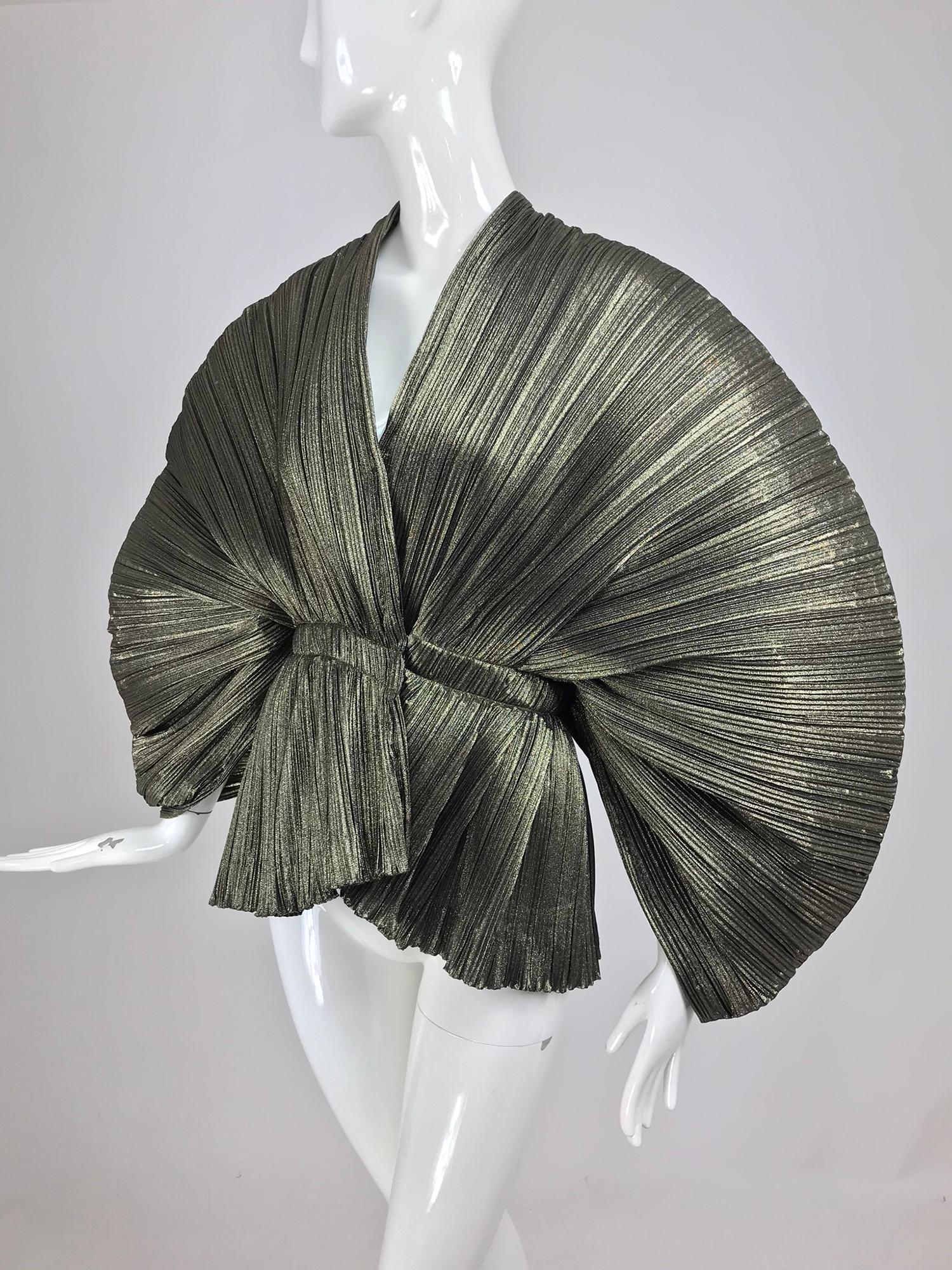 Avant Garde gold metallic accordion pleated sculpture jacket. This amazing and unique jacket is sure to cause a sensation wherever it's worn. Made from a bronze/gold permanently pleated metallic fabric that calls to mind Issey Miyake's designs.