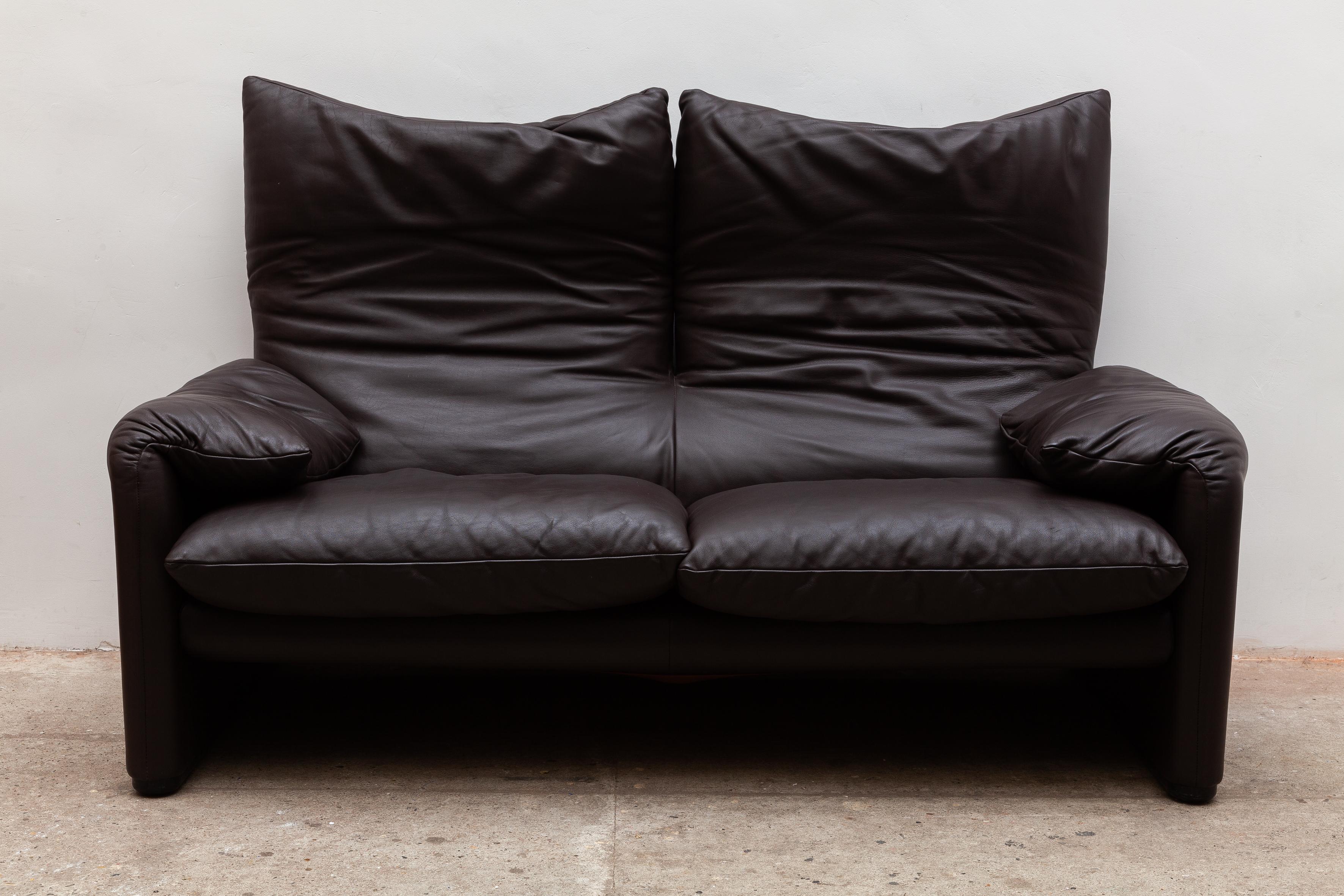 Two seat sofa “Maralunga”designed by Vico Magistretti for Cassina, Italy. Chocolate brown leather in excellent condition. This avant-garde mechanism, patented by Cassina, makes the back cushion unfold and move upwards, to form a head-rest.