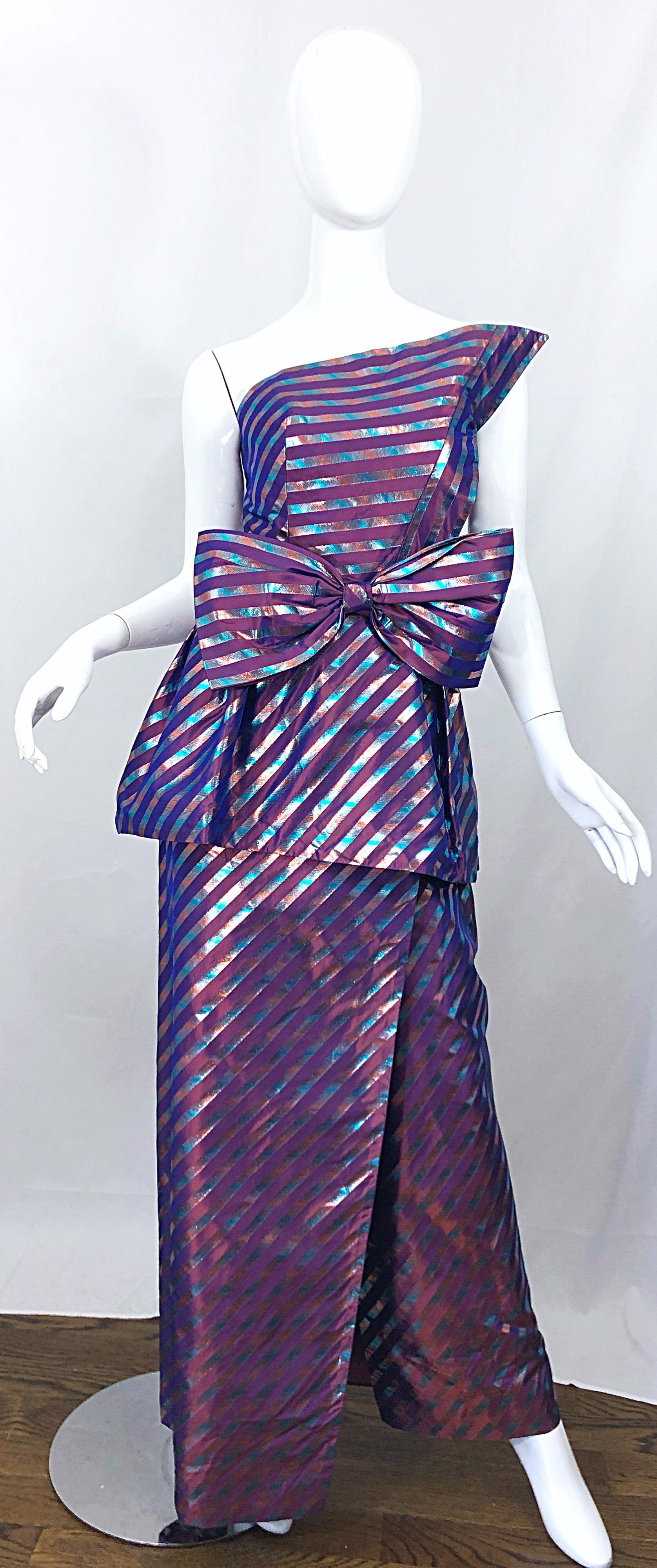 Beautiful 1980s RUBEN PANIS Couture for Eilzabeth Arden Avant Garde one shoulder metallic silk striped purple gown, with detachable bow belt! Beautiful iridescent purple, mixed with blue and pink flattering diagonal stripes throughout. Hidden zipper