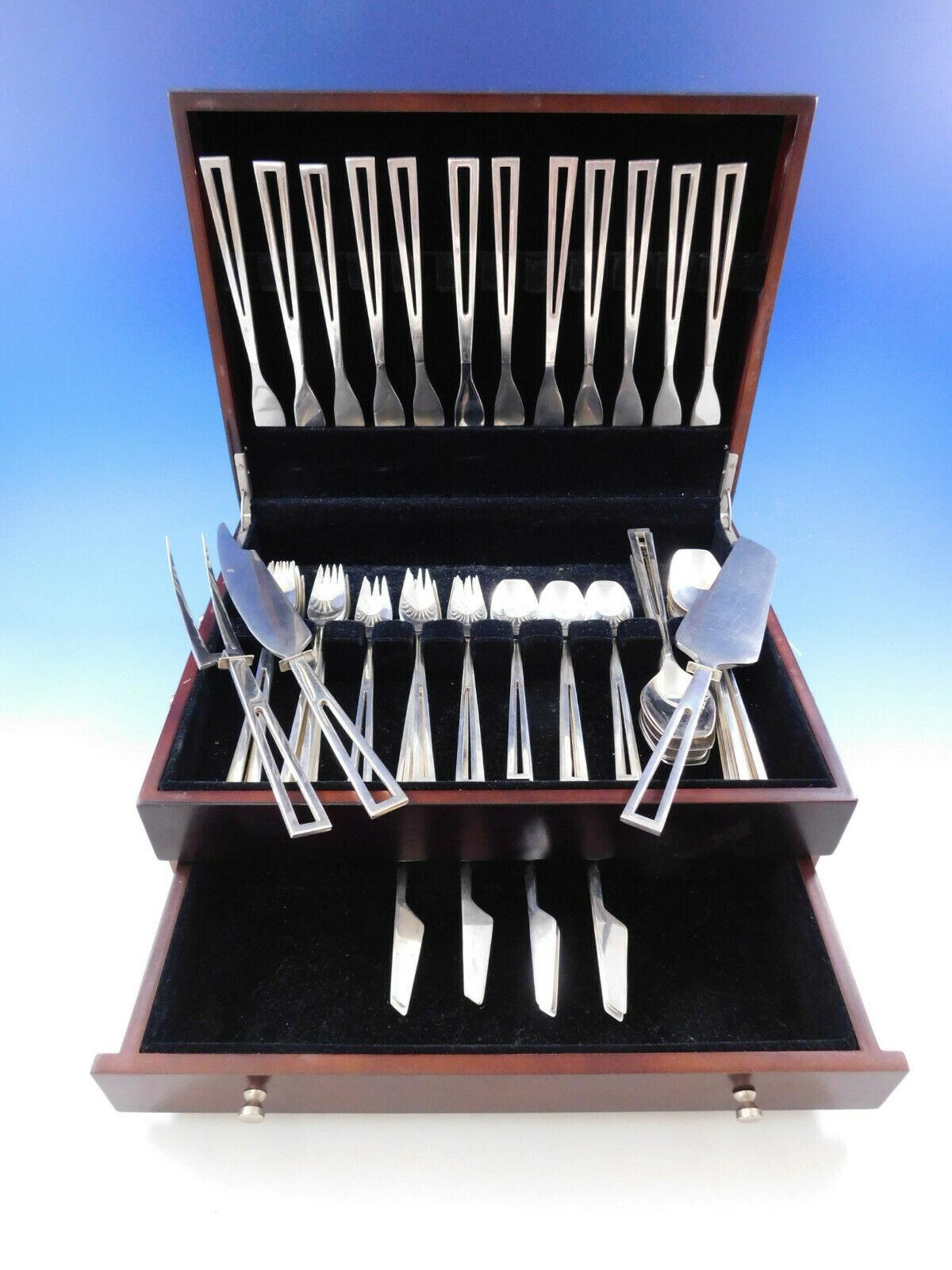 Rare, circa 1955 set of sterling silver flatware by Celsa, of Mexico, in the Avanti pattern. The pattern has a fantastic moderne geometric design with cut-out handles. Celsa had a retail store on 57th street in New York City in the 1950s.

This 75