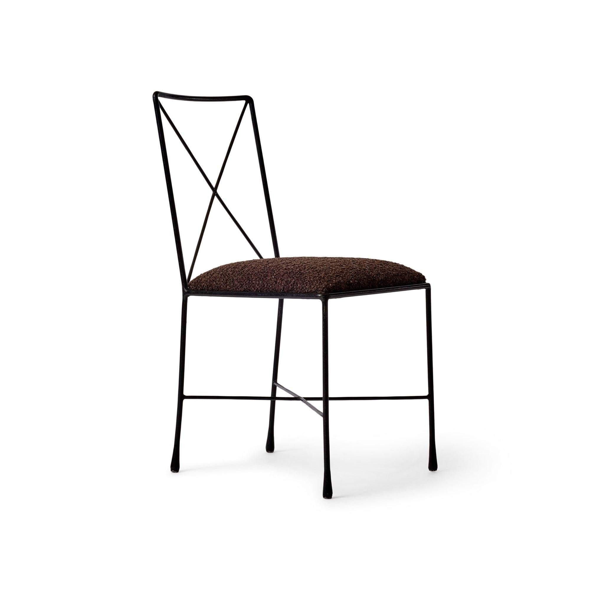 A very rare wrought iron 'X Back' chair designed and?made in NYC. This design was originally used in the 1950s at the outdoor terrace of MoMA in Manhattan.