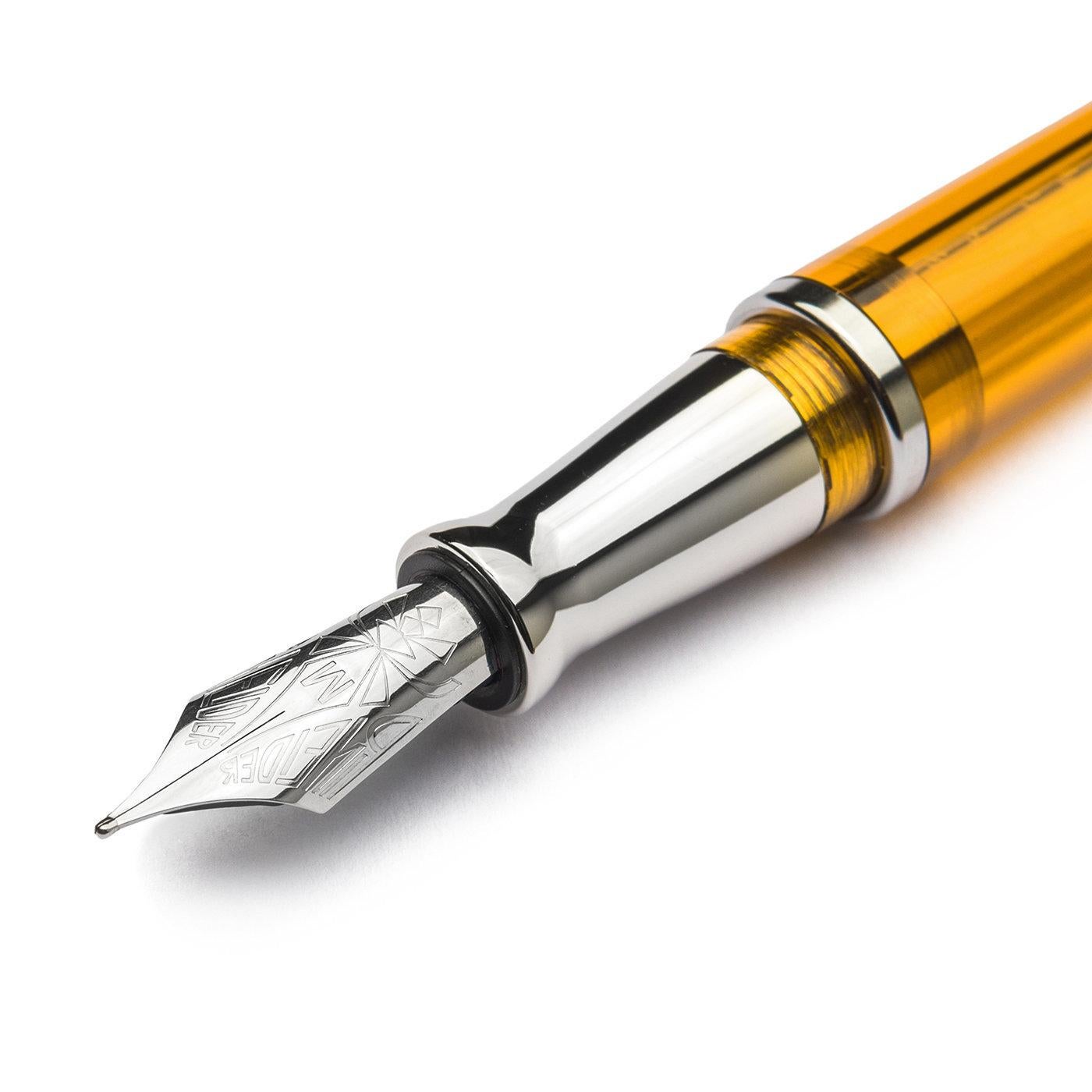 Fashioned of transparent, amber-hued UltraResin - an incredibly shock-resistant and pure material developed by Pineider - this fountain pen with soft-close cap lock was designed to keep its ink level always monitored but in style. It boasts a